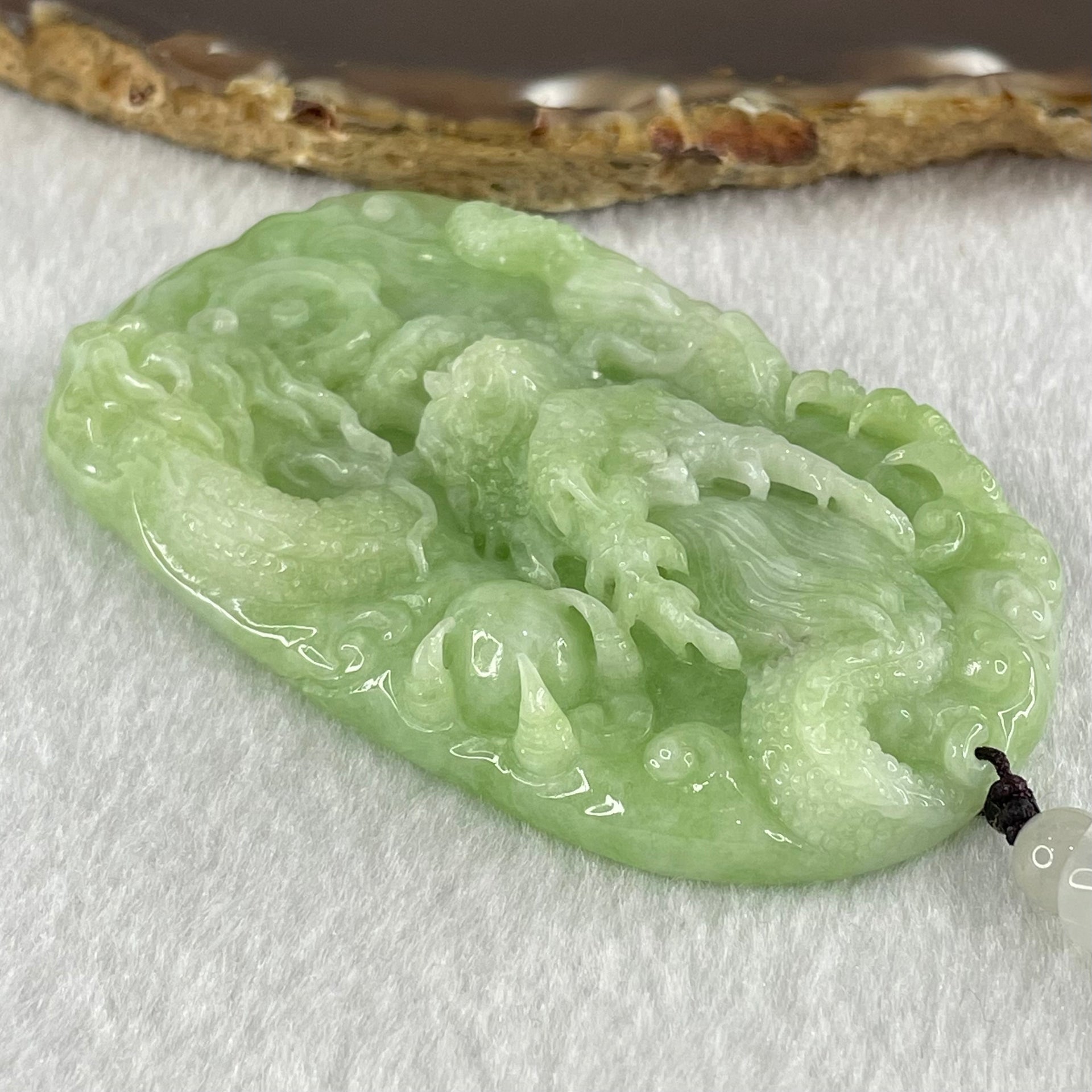 Type A Apple Green Jadeite Double Sided Fire Dragon Pendant 80.29g 75.3 by 44.4 by 13.2mm - Huangs Jadeite and Jewelry Pte Ltd