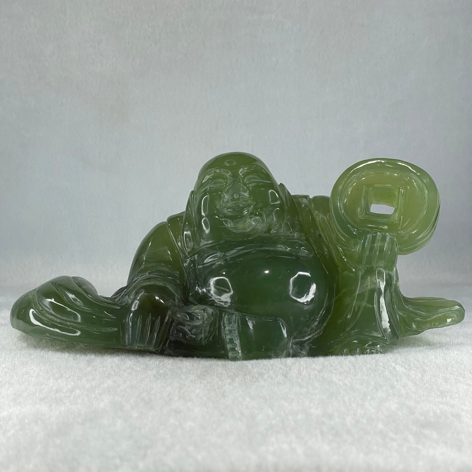 Natural Green Serpentine Siting Milo Buddha with Coin with Wooden Stand Display 1014.8g 200.0 by 100.0 by 105.0mm - Huangs Jadeite and Jewelry Pte Ltd