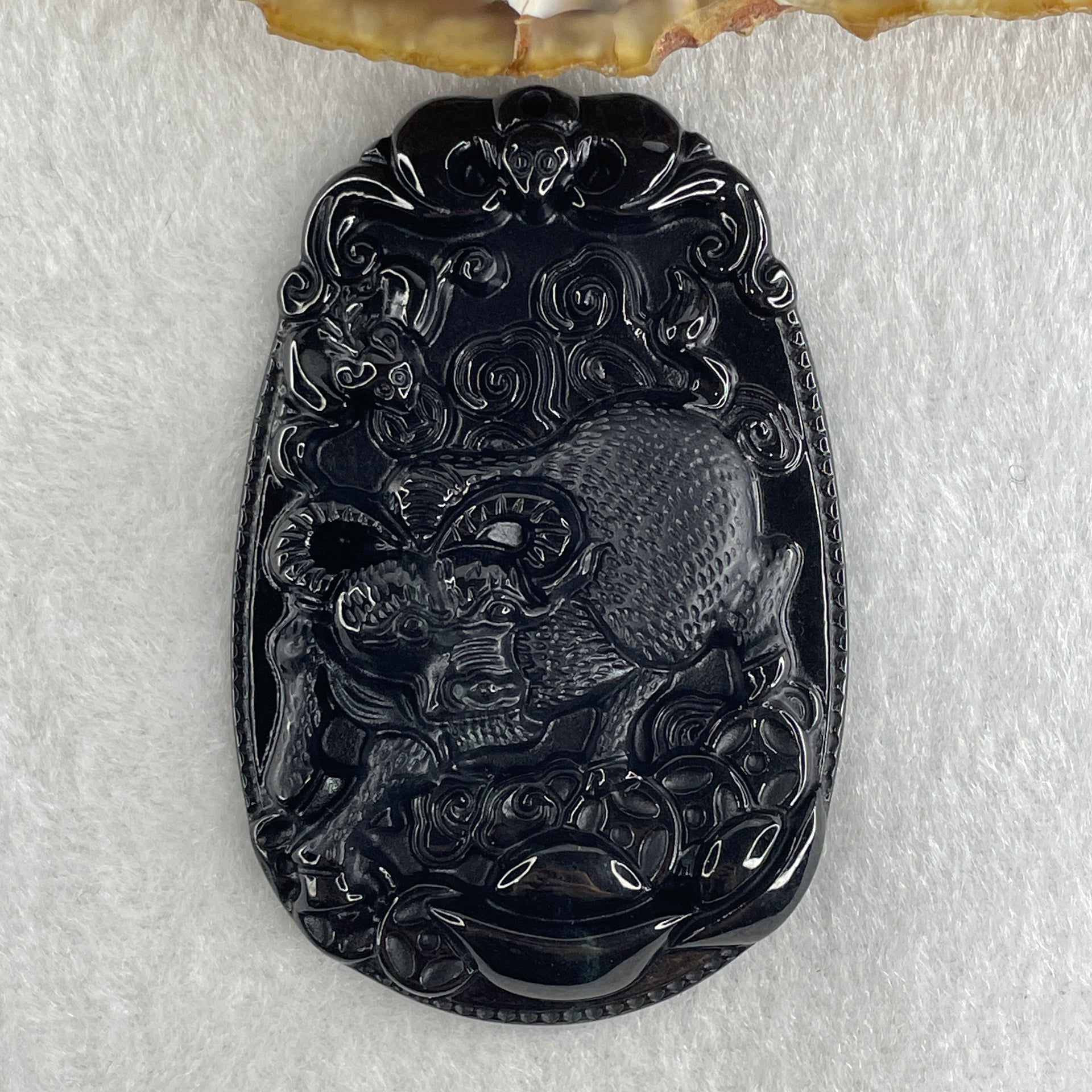 Type A Opaque to Partial Translucent Black Omphacite Jadeite Ox Pendant 20.24g 59.5 by 39.4 by 7.6mm - Huangs Jadeite and Jewelry Pte Ltd