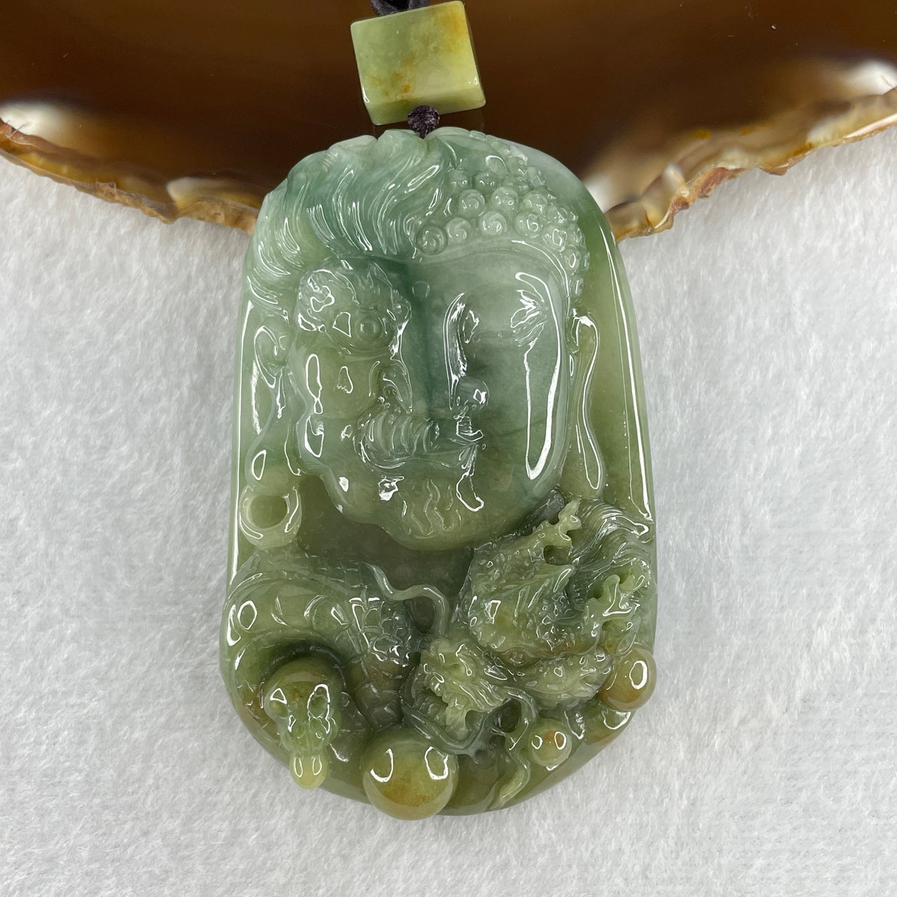 Natural Type A Blueish Green with Light Brown Jadeite Good Vs Evil (Buddha Vs Devil) with Dragon 80.23g 68.0 by 43.7 by 12.3mm
