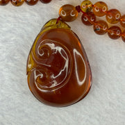Natural Cognac Amber Ruyi Pendent 37.7 by 27.0 by 12.2mm in Amber Beads Necklace 6.3mm 105 Beads Total 19.80g - Huangs Jadeite and Jewelry Pte Ltd