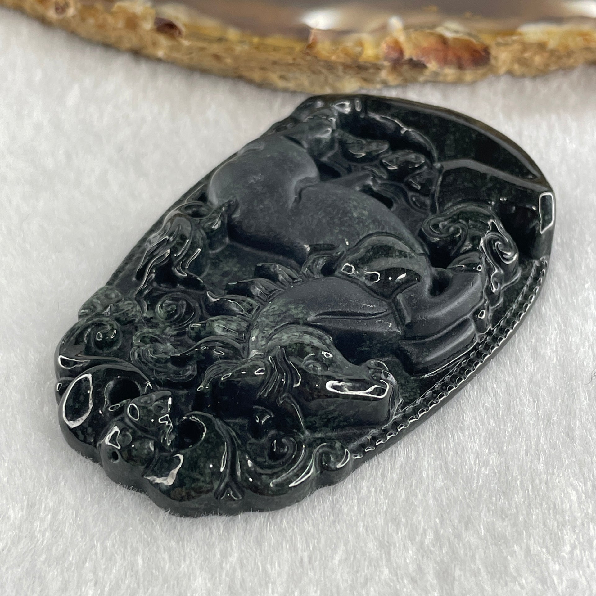 Type A Opaque to Partial Translucent Black Omphacite Jadeite Horse Pendant 26.34g 60.1 by 40.3 by 8.0mm - Huangs Jadeite and Jewelry Pte Ltd