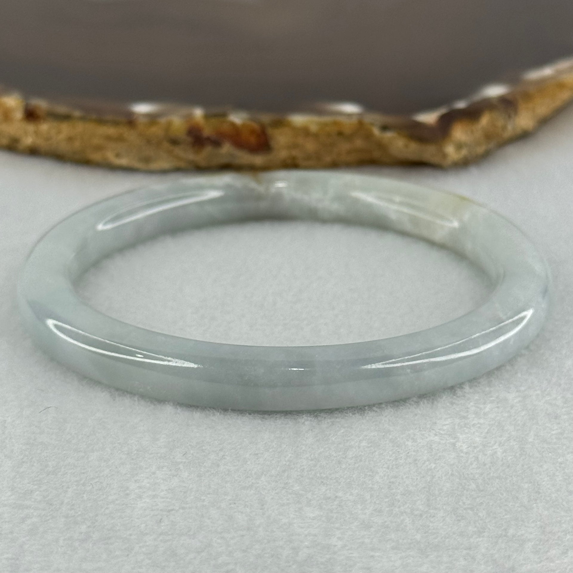 Type A Sky Blue with Green and Brown Patch Jadeite Oval Bangle Internal Diameter 58.0mm 32.09g 7.4 by 7.9mm (External Rough with Internal Lines) - Huangs Jadeite and Jewelry Pte Ltd