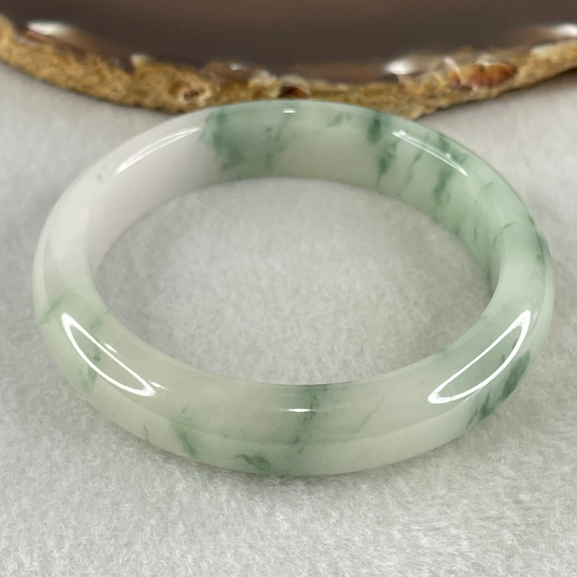 Type A Jelly Light Green with Blueish Green Piao Hua Floral Jadeite Bangle 55.51g Inner Diameter 56.3mm 12.6 by 8.4mm (Slight Internal Lines) - Huangs Jadeite and Jewelry Pte Ltd