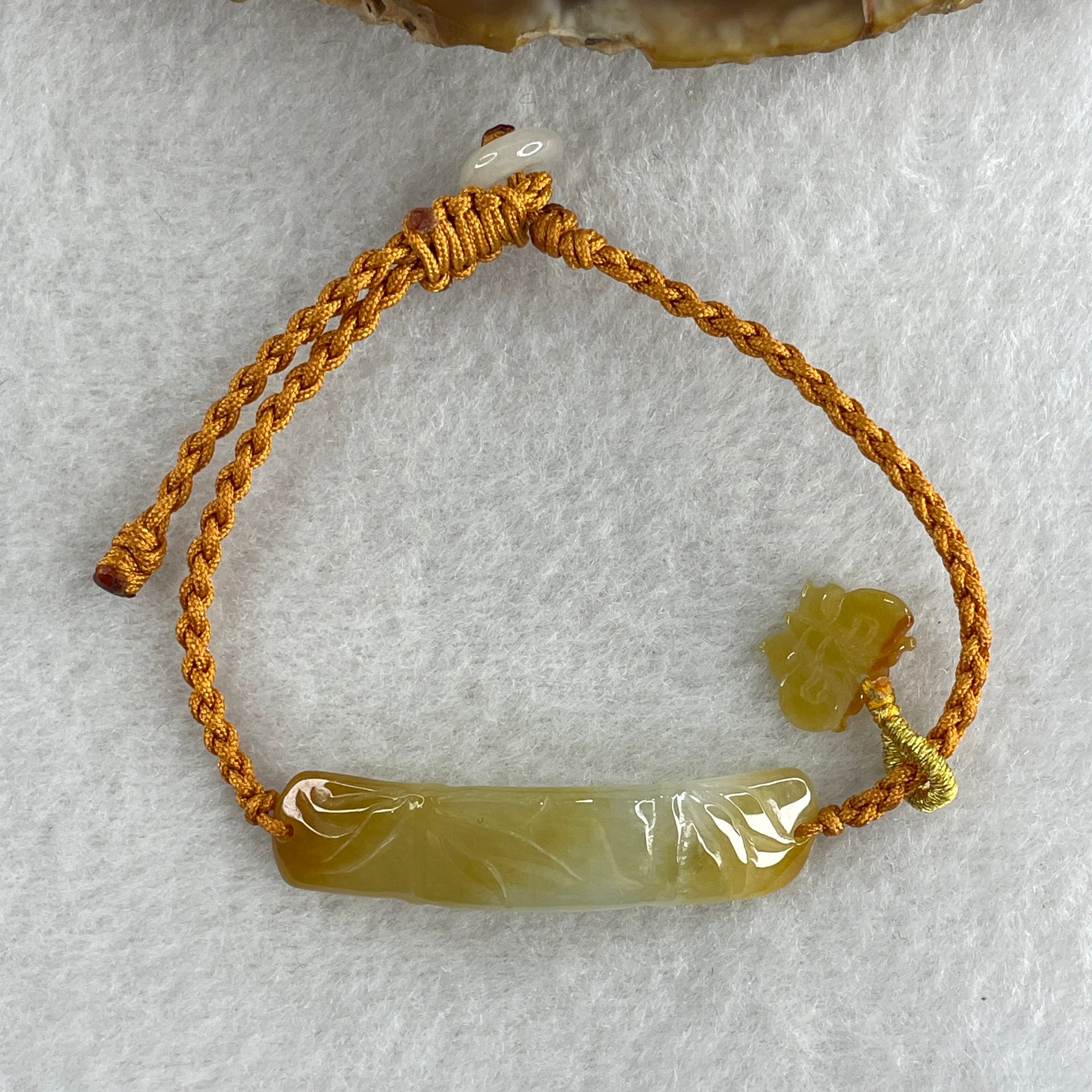 Natural Type A Yellowish with Light Green Jadeite Bamboo with Butterfly in String Bracelet 3.97g 14-16cm 39.1 by 9.1 by 2.9mm - Huangs Jadeite and Jewelry Pte Ltd