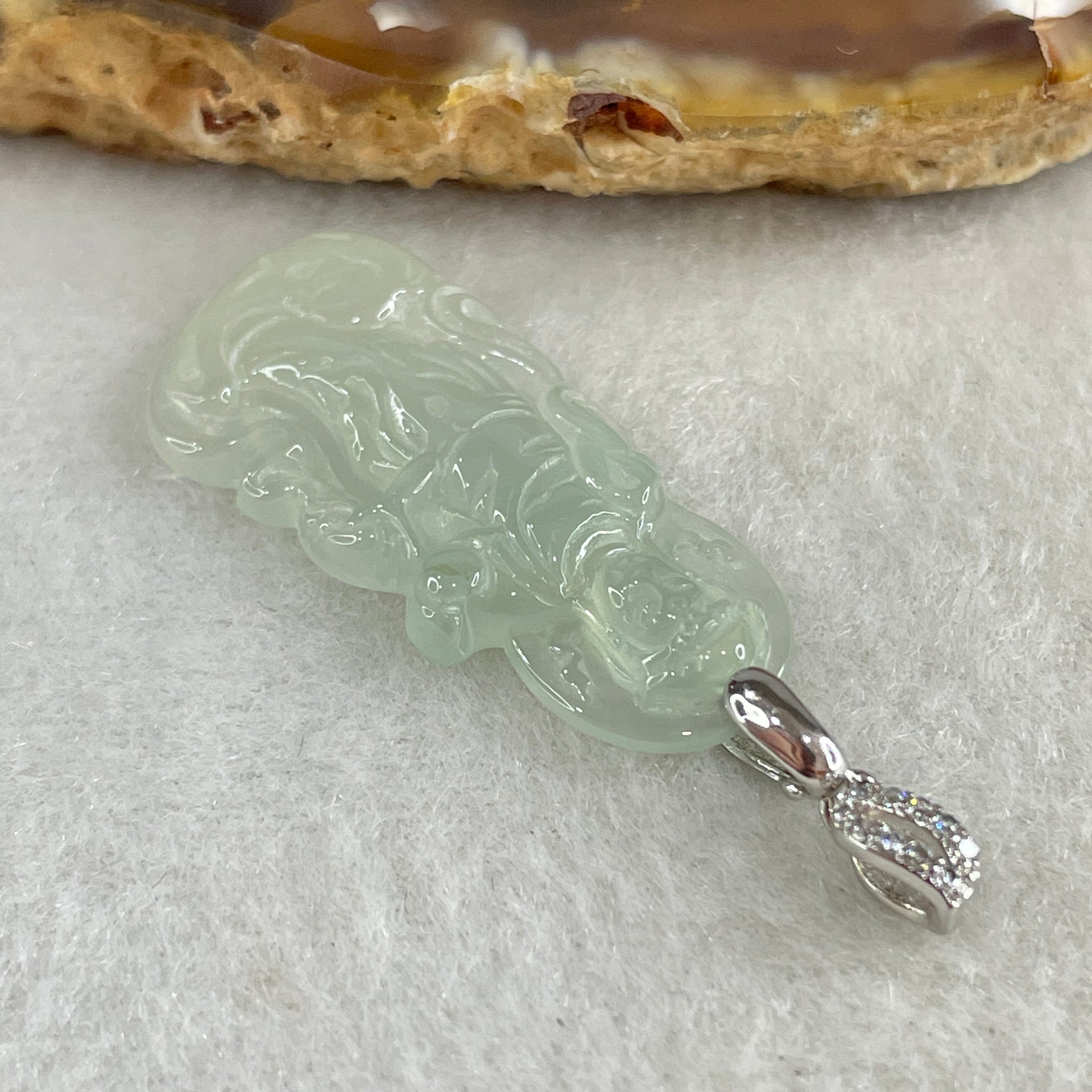 Type A Icy Colourless to Faint Green Jadeite Guan Yin Pendant 3.0g 31.0 by 14.5 by 3.5mm - Huangs Jadeite and Jewelry Pte Ltd