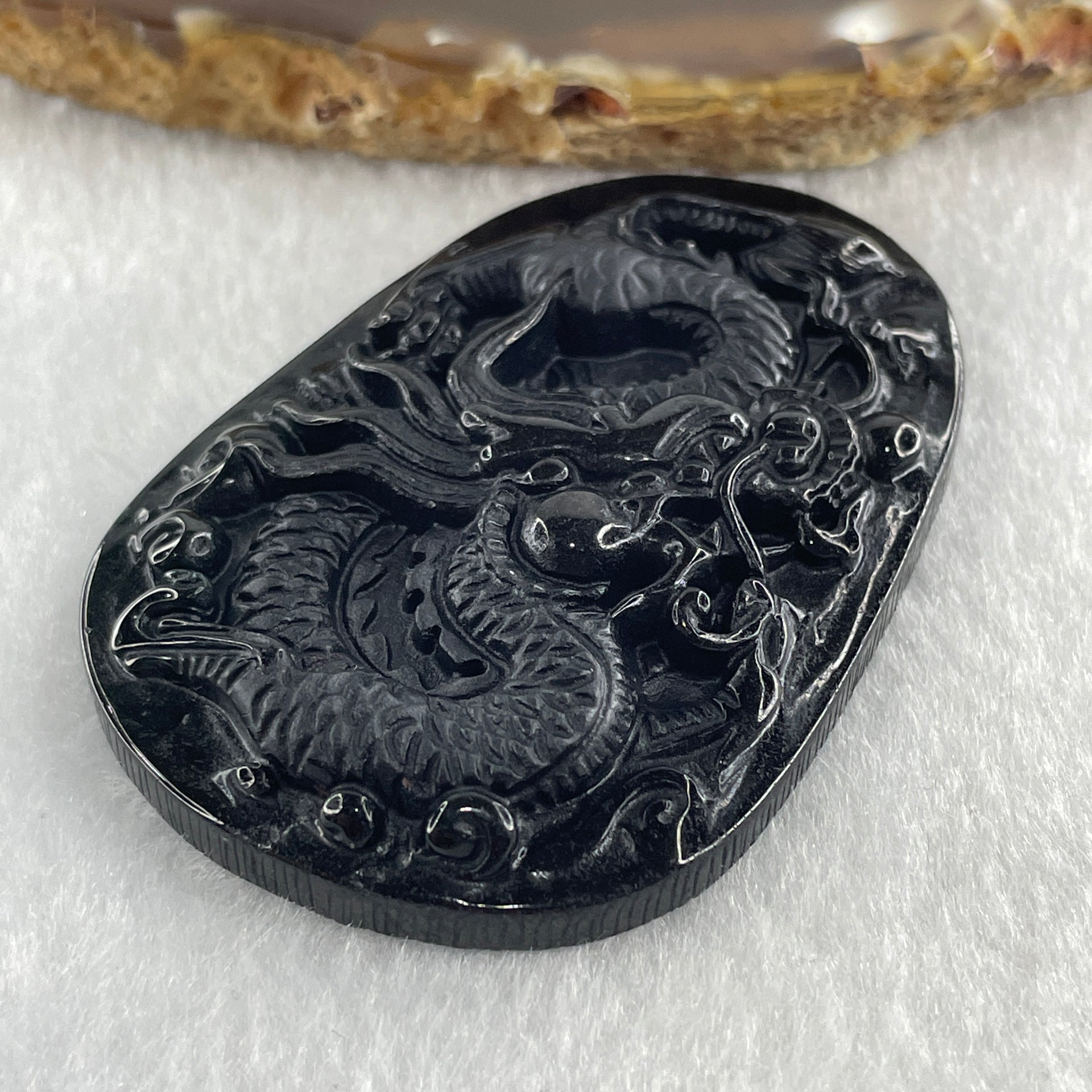 Type A Opaque to Partial Translucent Black Omphacite Jadeite Dragon Pendant 24.58g 58.2 by 40.3 by 8.2mm - Huangs Jadeite and Jewelry Pte Ltd