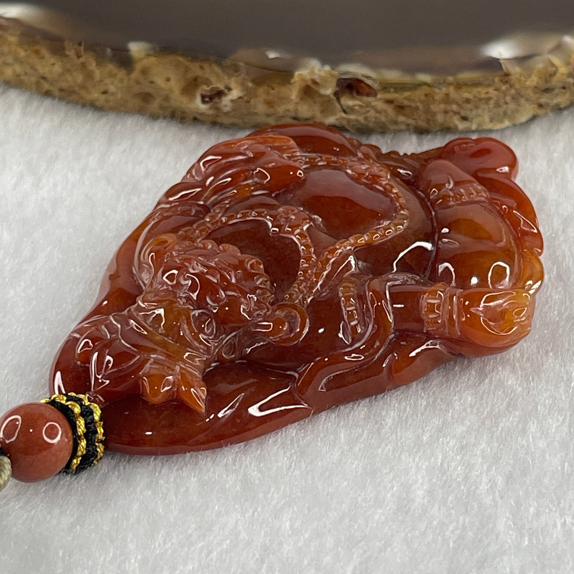 Type A Brownish Red Jadeite Jambhala Pendant 50.23g 63.6 by 45.6 by 1.5mm - Huangs Jadeite and Jewelry Pte Ltd