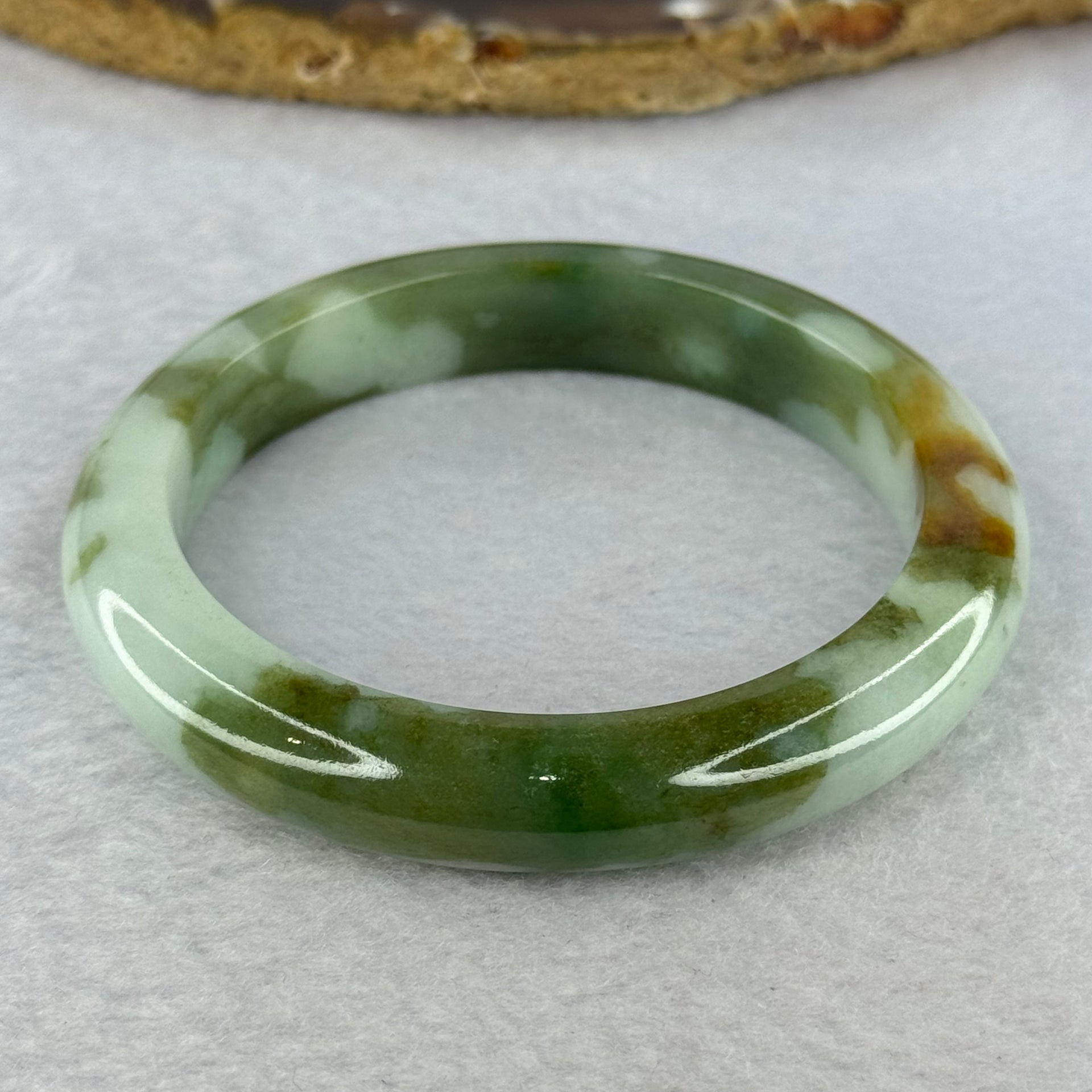 Type A Light Green and Moss Green and Brown Patches Jadeite Bangle 55.5mm 51.12g 10.6 by 9.0mm (Slight Internal Line) - Huangs Jadeite and Jewelry Pte Ltd