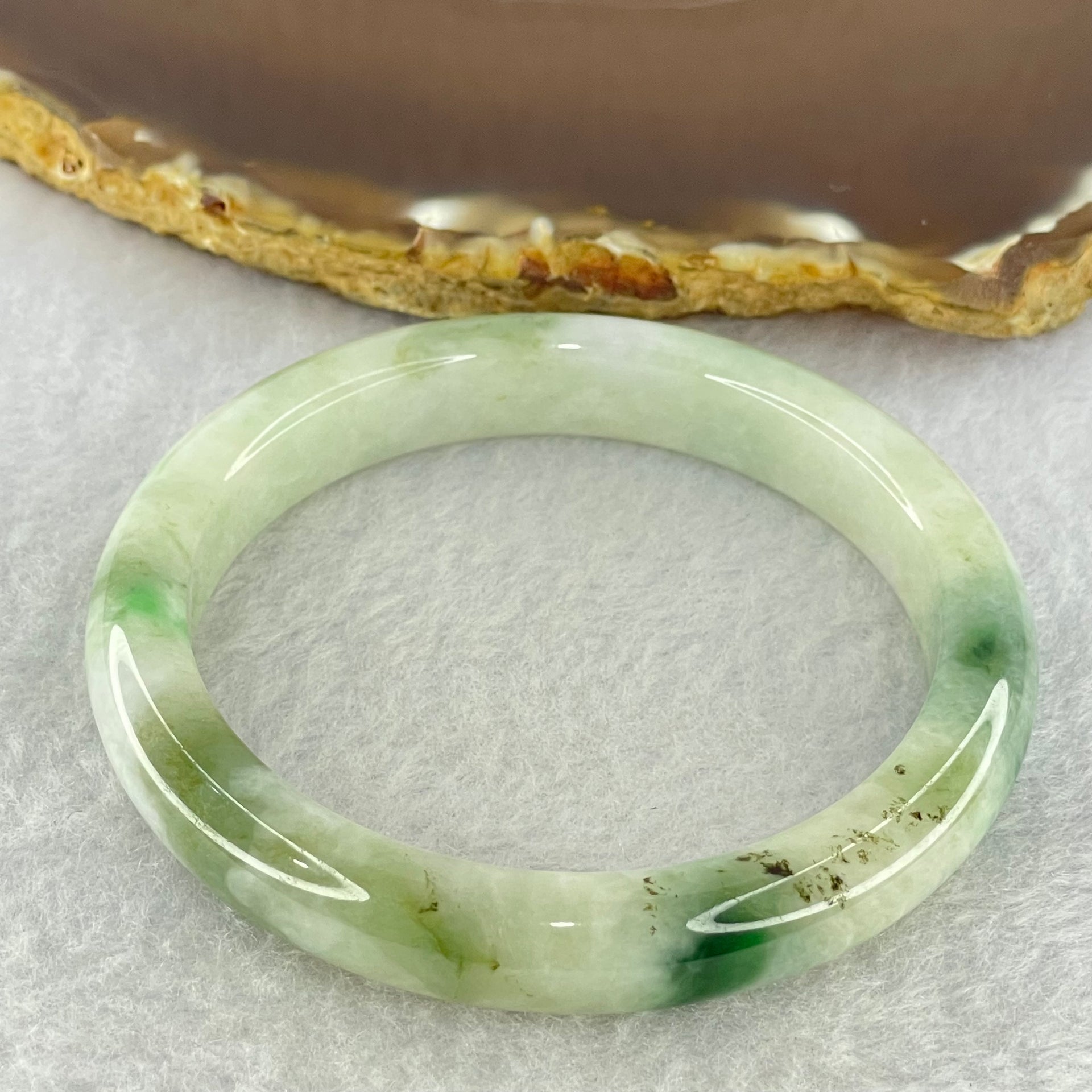 Type A Light Green with Moss Green Piao Hua Jadeite Bangle Internal Diameter 55.6mm 41.97g 10.4 by 7.6mm ( Very Slight External Rough + Internal Lines) - Huangs Jadeite and Jewelry Pte Ltd