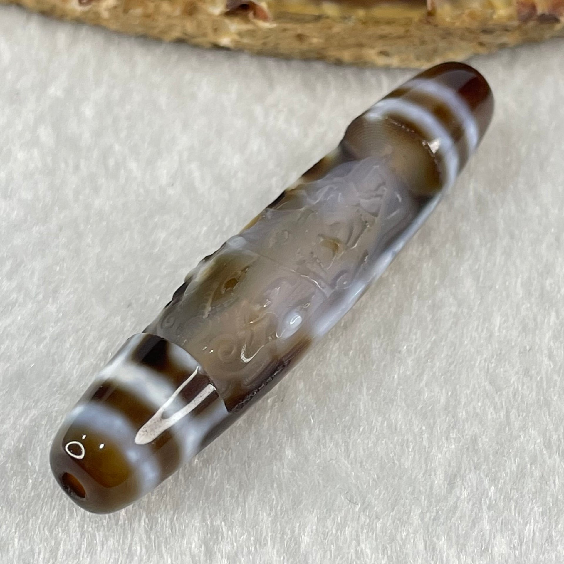 Natural Powerful Tibetan Old Oily Agate Zha Ji La Mu Female Cai Shen Carvings on 9 Eyes Dzi Bead Heavenly Master (Tian Zhu) 九眼扎基拉姆女财神天珠 11.04g 57.9 by 12.0mm - Huangs Jadeite and Jewelry Pte Ltd