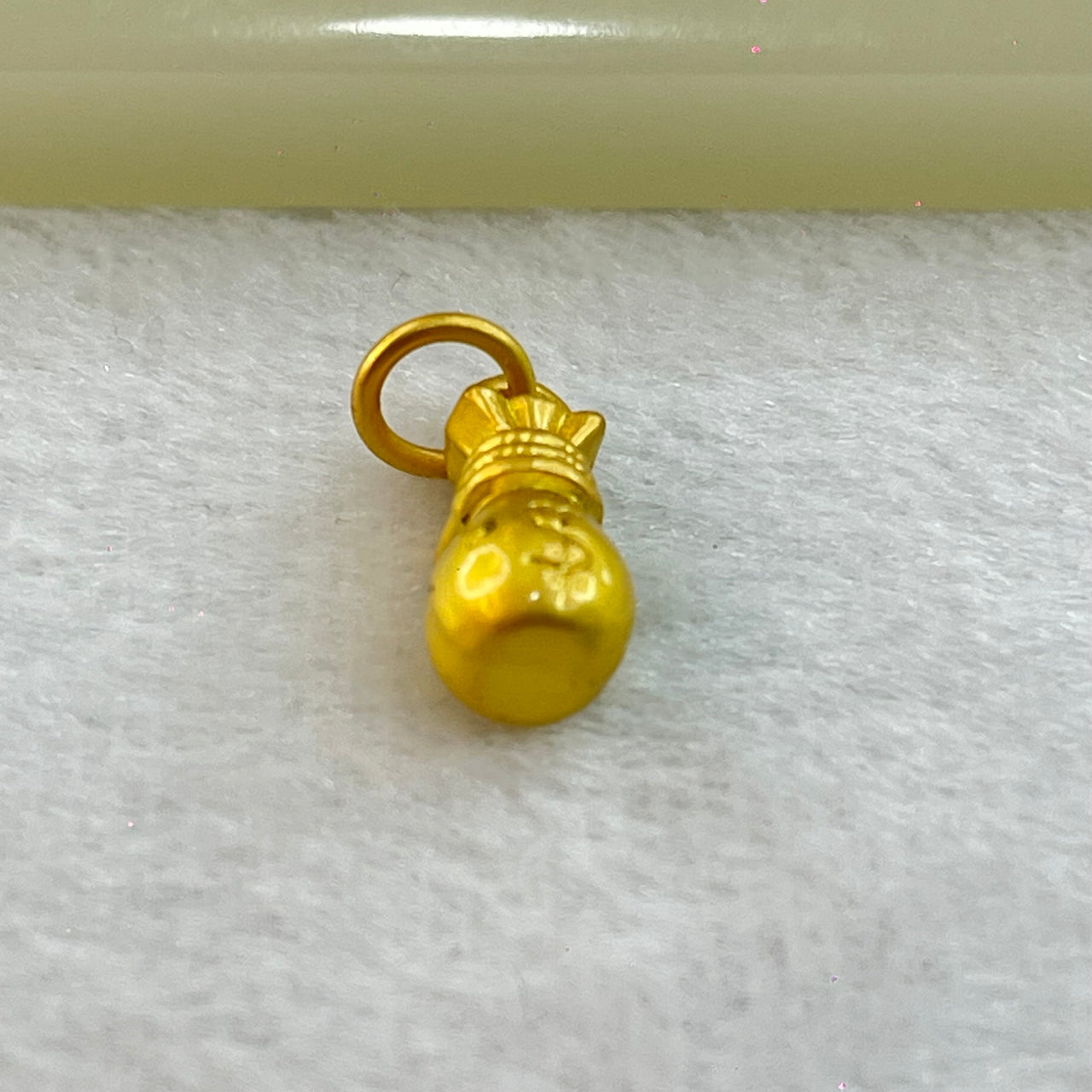 Tiny Money Bag Charm 1.91g 14.7 by 6.8mm - Huangs Jadeite and Jewelry Pte Ltd