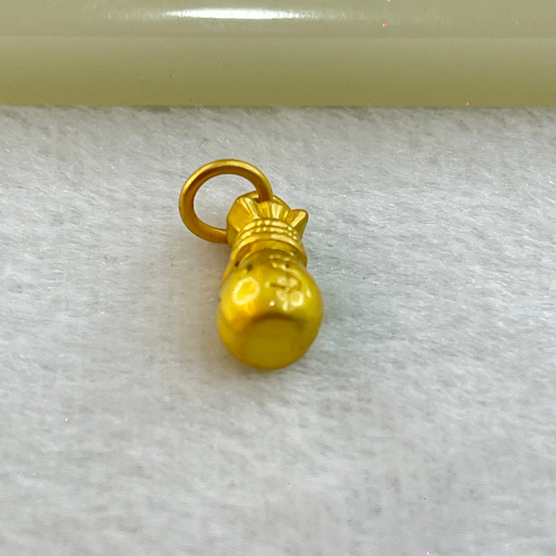 Tiny Money Bag Charm 1.91g 14.7 by 6.8mm - Huangs Jadeite and Jewelry Pte Ltd