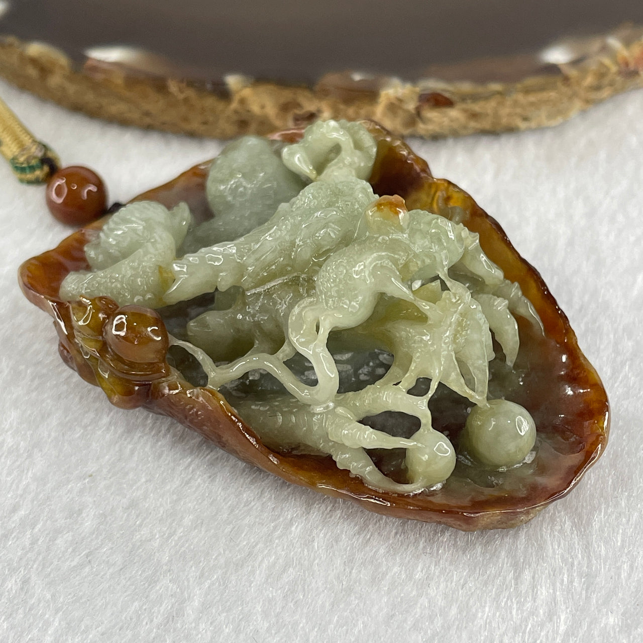 Type A Green with Brownish Jadeite Dragon Pendant 75.51g 68.8 by 49.5 by 28.9mm