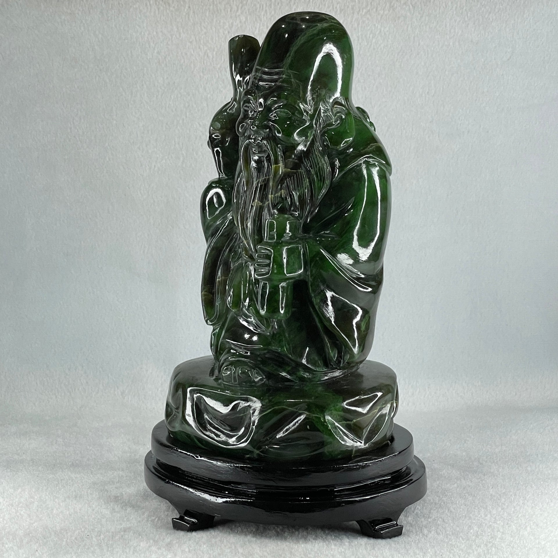 Natural Dark Green Serpentine Shou Xing Gong with Wooden Stand Display 2,374.7g 140.0 by 228.0 by 125.0mm - Huangs Jadeite and Jewelry Pte Ltd