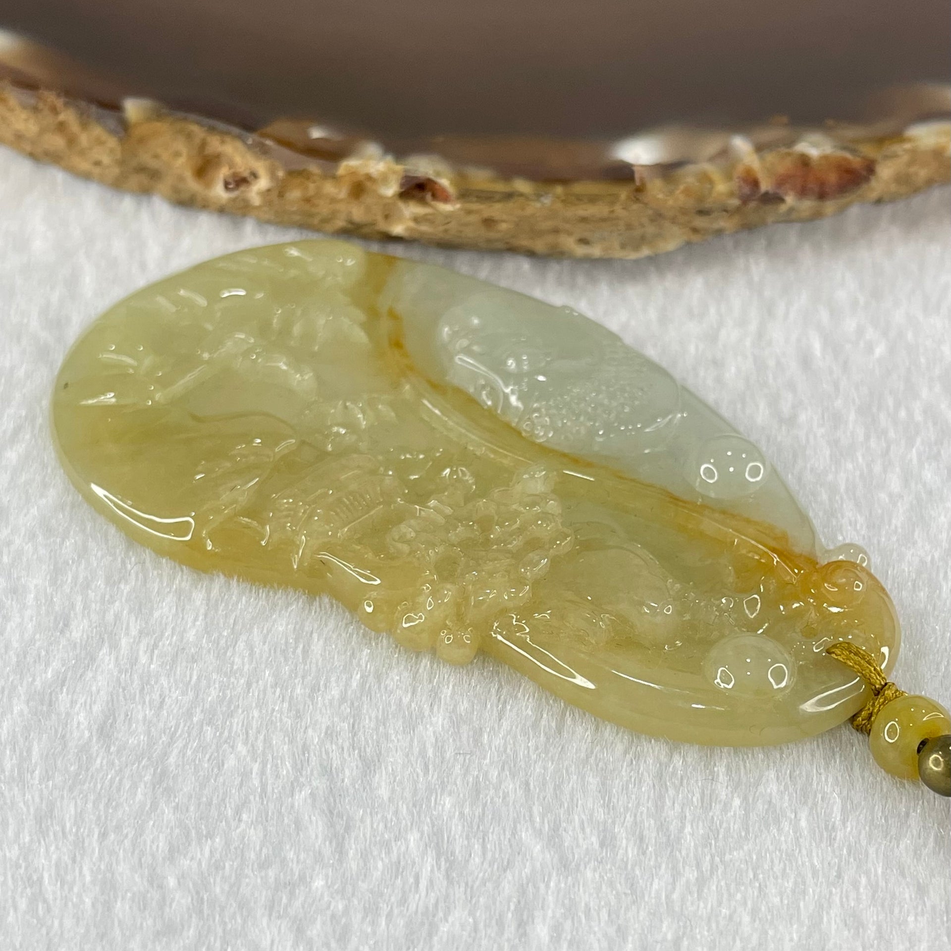 Grandmaster Type A Yellow with Faint Green and Red Jadeite Shan Shui with Buddha Pendant 22.54g 69.8 by 39.7 by 4.8mm - Huangs Jadeite and Jewelry Pte Ltd