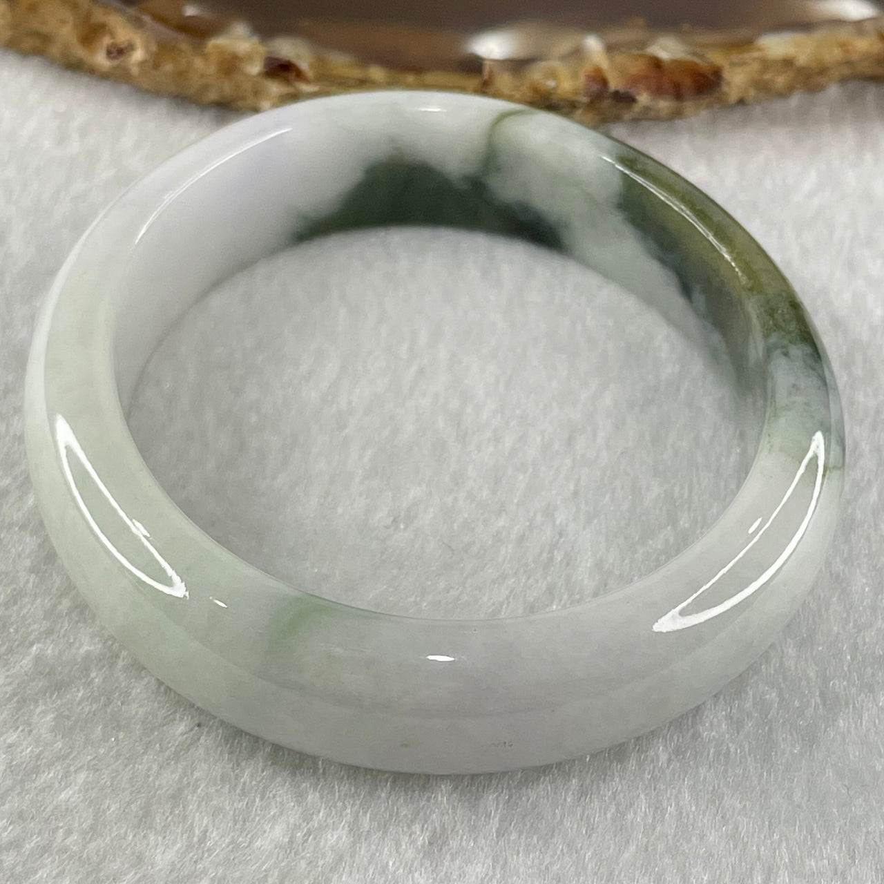 Type A Faint Lavender with Moss Green Patches Jadeite Oval Bangle 43.11g Internal Diameter 53.3mm 13.5 by 6.9mm (Slight External Roughs and Internal Lines) - Huangs Jadeite and Jewelry Pte Ltd