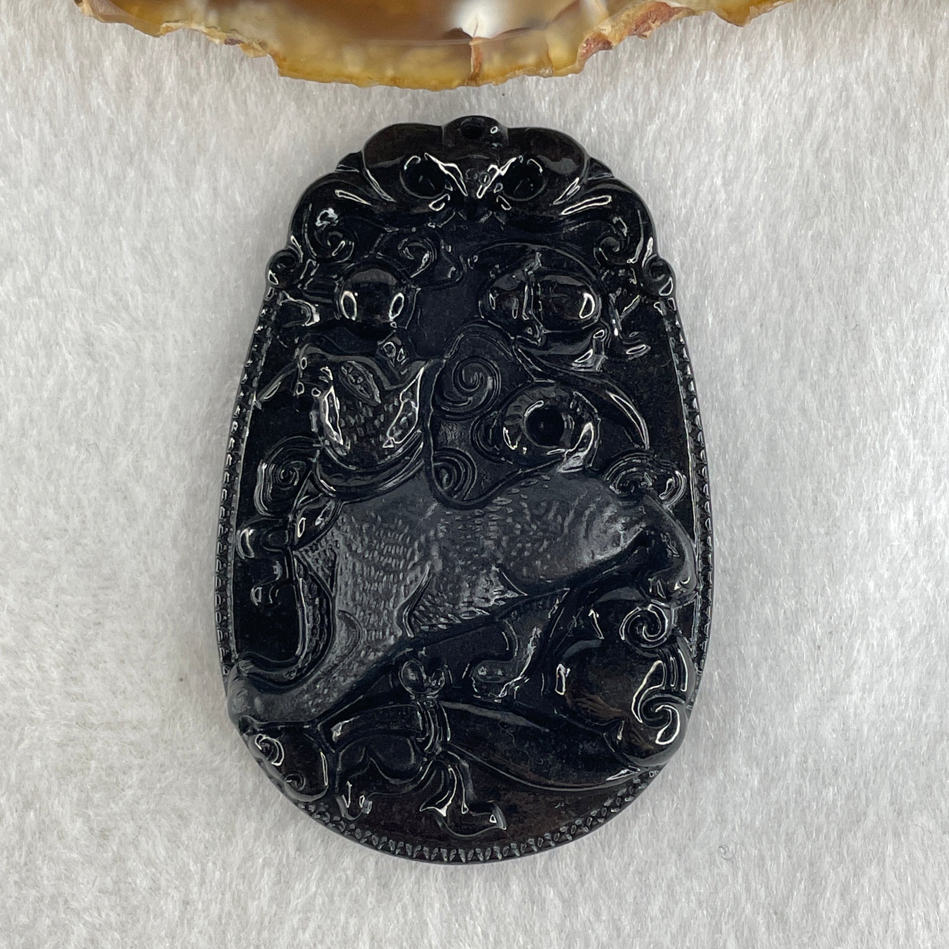Type A Opaque to Partial Translucent Black Omphacite Jadeite Dog Pendant 23.89g 59.8 by 39.8 by 8.6mm - Huangs Jadeite and Jewelry Pte Ltd