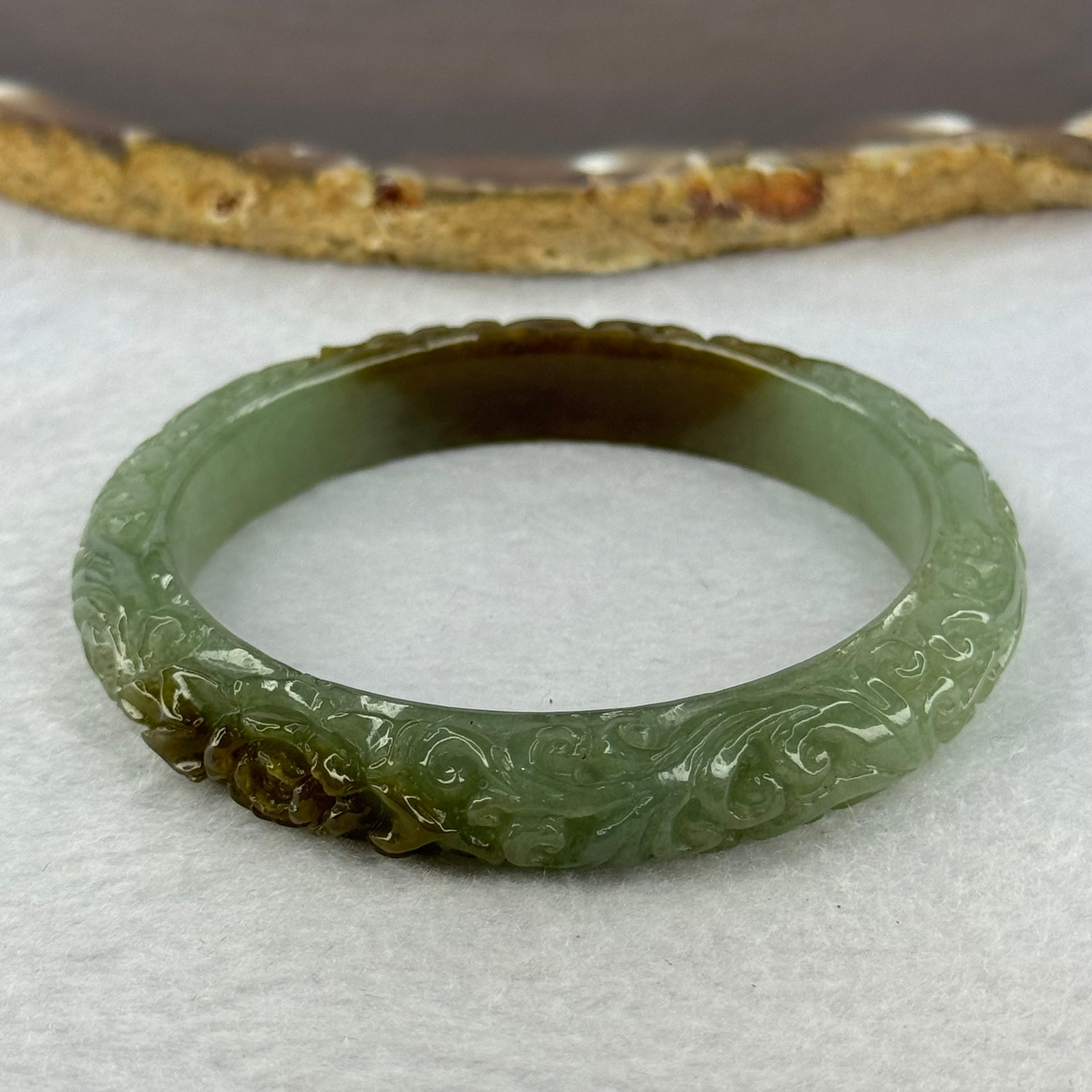 Type A Blueish Green and Brown Patches Jadeite Lotus Flowers Bangle 39.19g Internal Diameter 55.2mm 10.9 by 8.2mm - Huangs Jadeite and Jewelry Pte Ltd