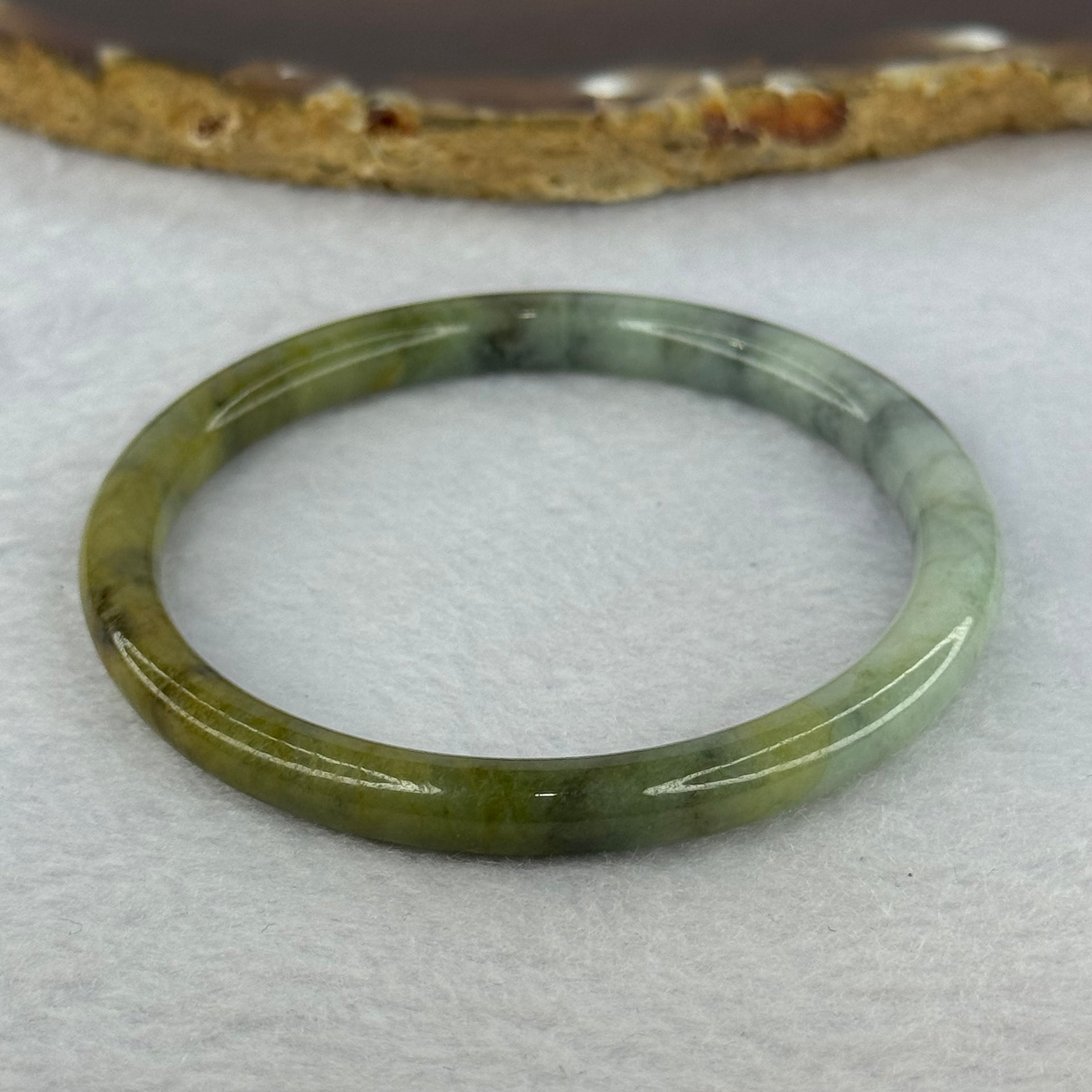 Type A Brownish Green with Green Piao Hua Jadeite Bangle 19.16g Internal Diameter 53.5mm 6.5 by 6.7mm (Slight External Line) - Huangs Jadeite and Jewelry Pte Ltd