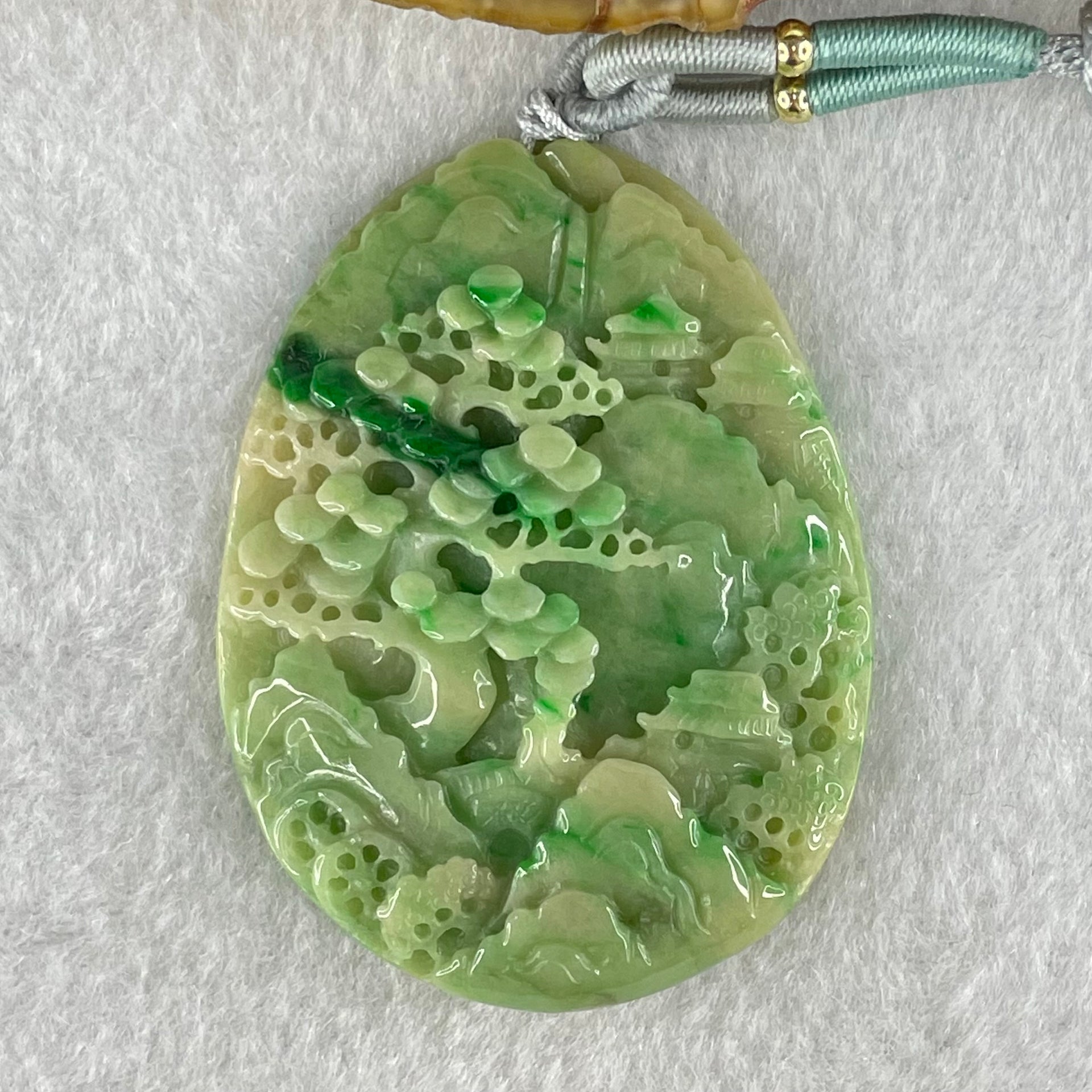 Type A Green with Yellow Spicy Green Piao Hua and Light Brown Patches Jadeite Double Sided Shan Shui with Gui Ren Benefactor Pendant 30.43g 54.0 by 40.8 by 8.4mm - Huangs Jadeite and Jewelry Pte Ltd