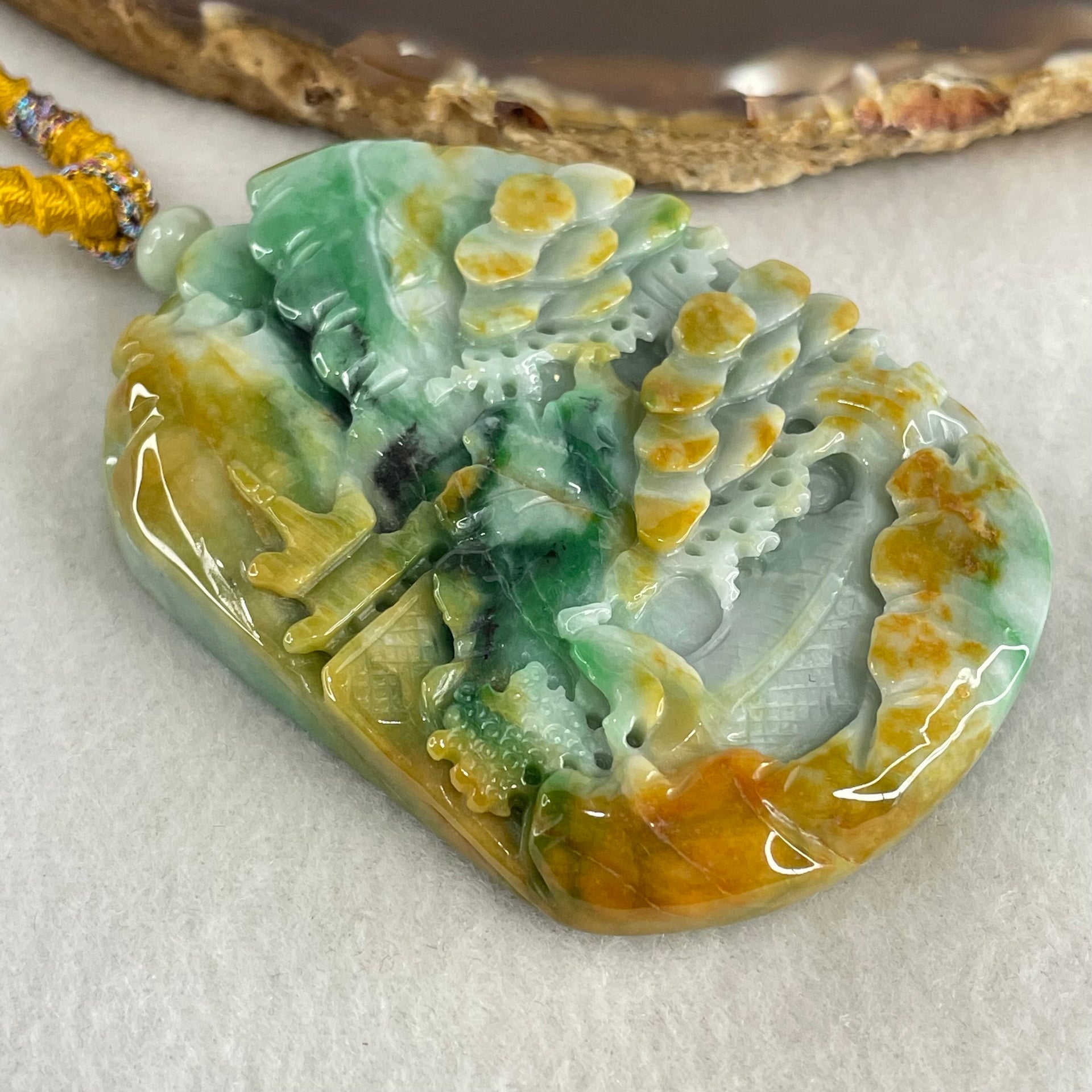 Type A Brown Blueish Green with Yellow Jadeite Shan Shui with Guiren Benefactor Pendant 93.95g 66.8 by 49.0 by 13.8mm - Huangs Jadeite and Jewelry Pte Ltd