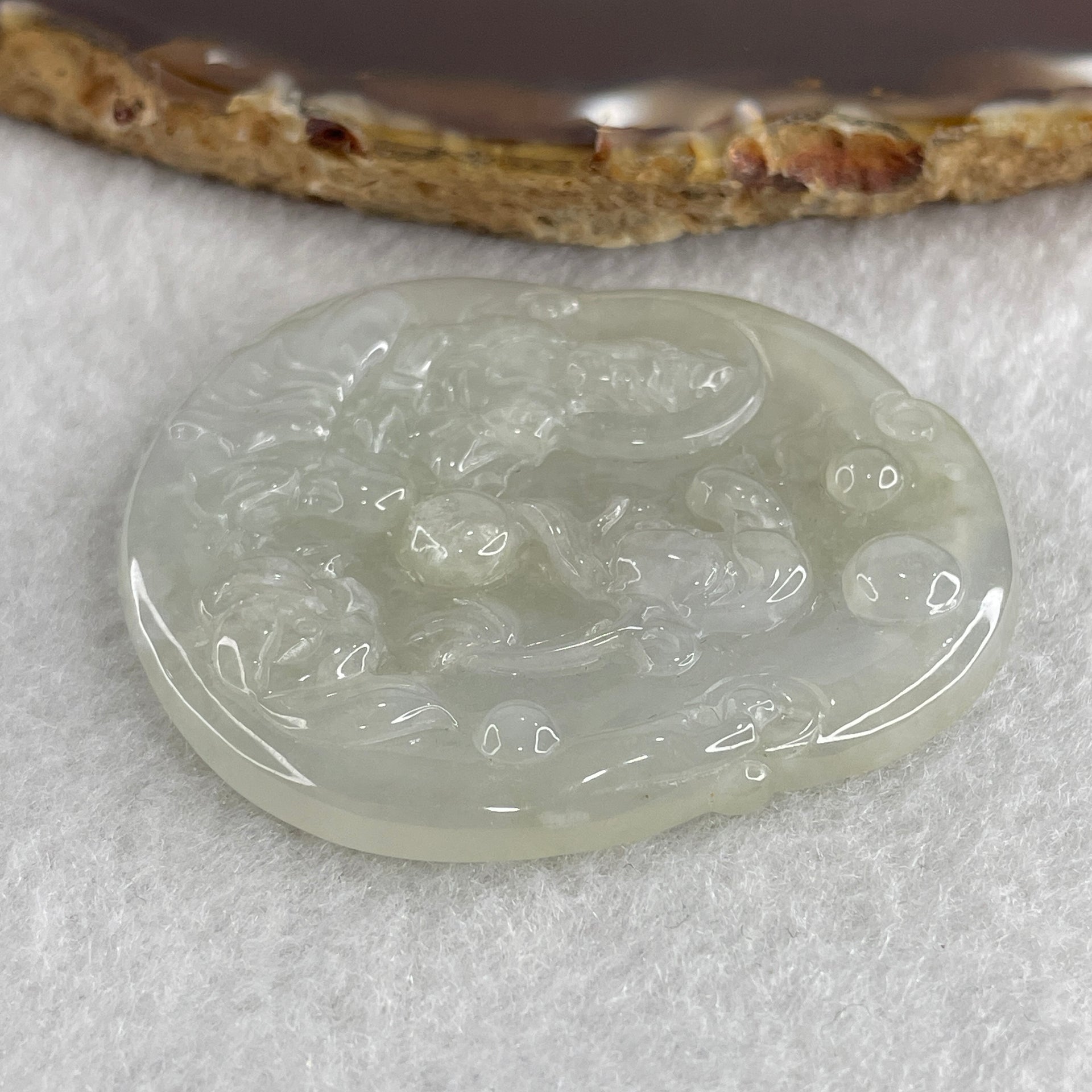 Natural Type A Semi Icy Colorless Jadeite Guan Yin with Lotus Flower Pendant 23.37g 52.8 by 46.7 by 5.2mm - Huangs Jadeite and Jewelry Pte Ltd