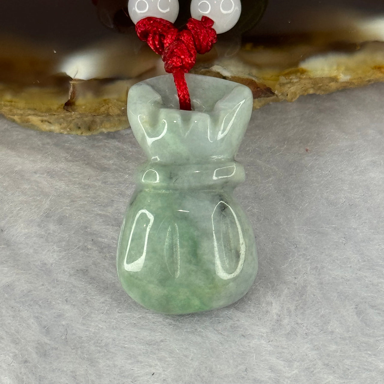 Type A Green Jadeite Money Bag Pendent 7.80g 24.9 by 14.4 by 8.2mm - Huangs Jadeite and Jewelry Pte Ltd