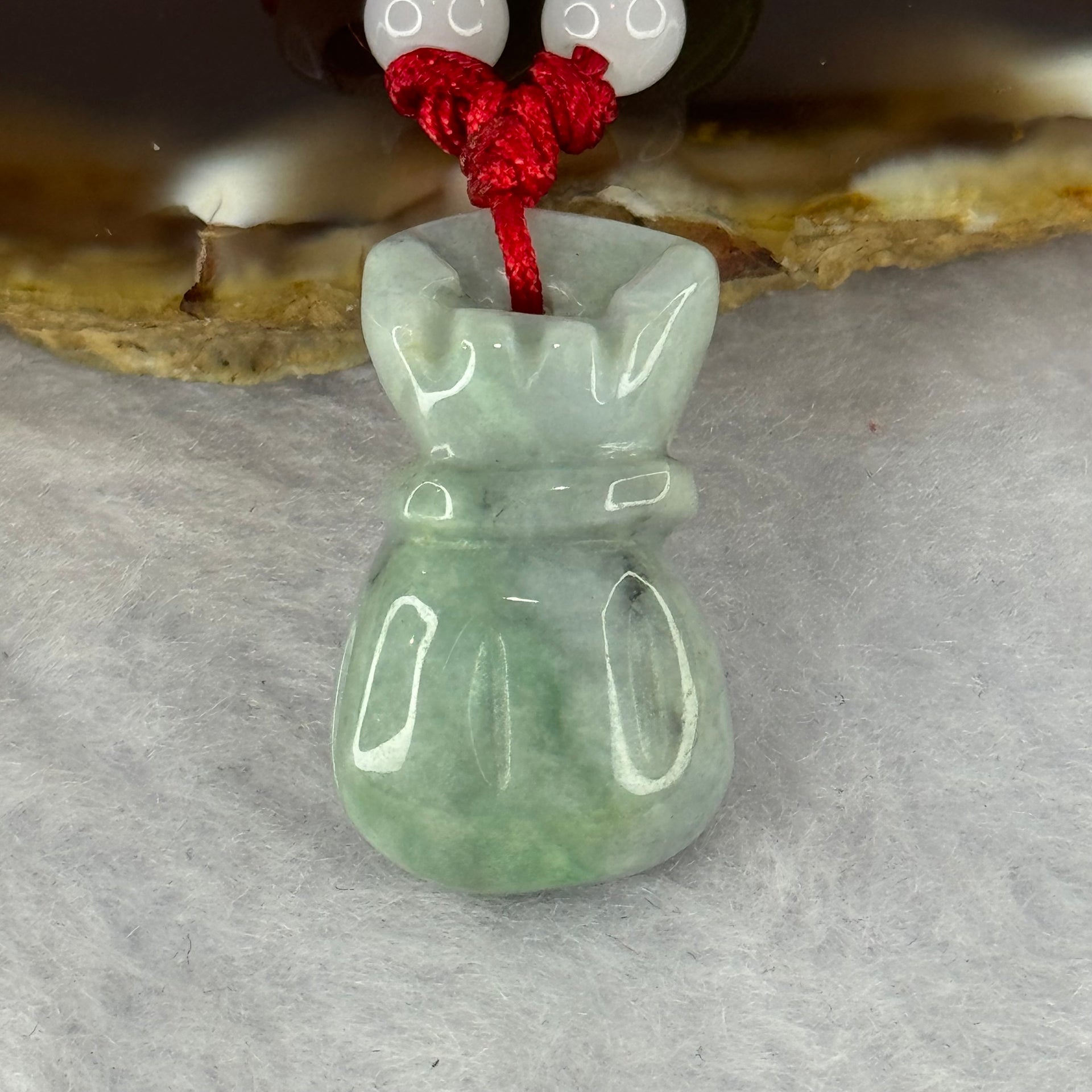Type A Green Jadeite Money Bag Pendent 7.80g 24.9 by 14.4 by 8.2mm - Huangs Jadeite and Jewelry Pte Ltd