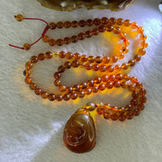 Natural Cognac Amber Ruyi Pendent 37.7 by 27.0 by 12.2mm in Amber Beads Necklace 6.3mm 105 Beads Total 19.80g - Huangs Jadeite and Jewelry Pte Ltd