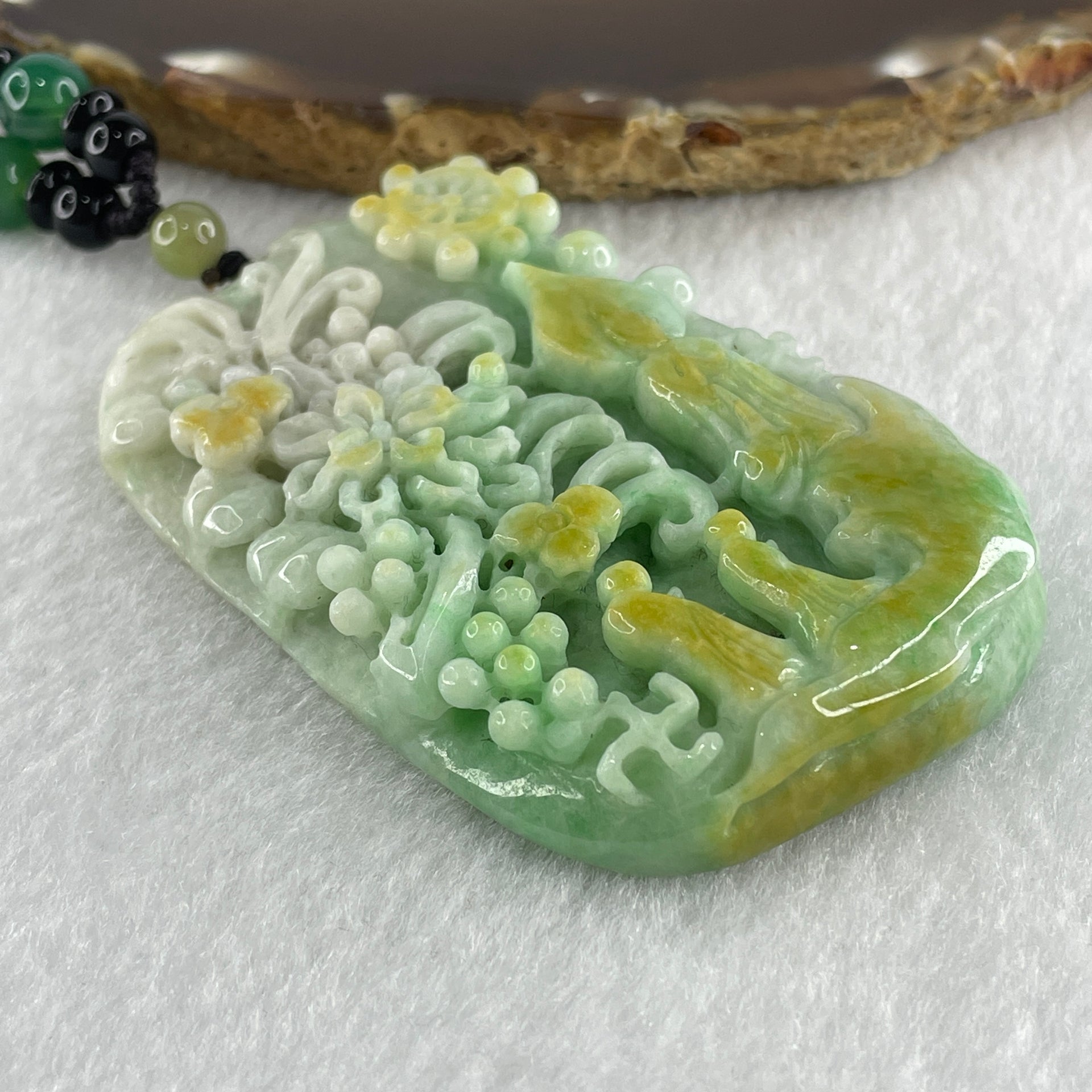 Natural Type A Blueish Green with Yellow Jadeite Buddha and Flowers with People Seeking for Enlightenment Pendant 87.75g 72.8 by 45.7 by 11.8mm - Huangs Jadeite and Jewelry Pte Ltd