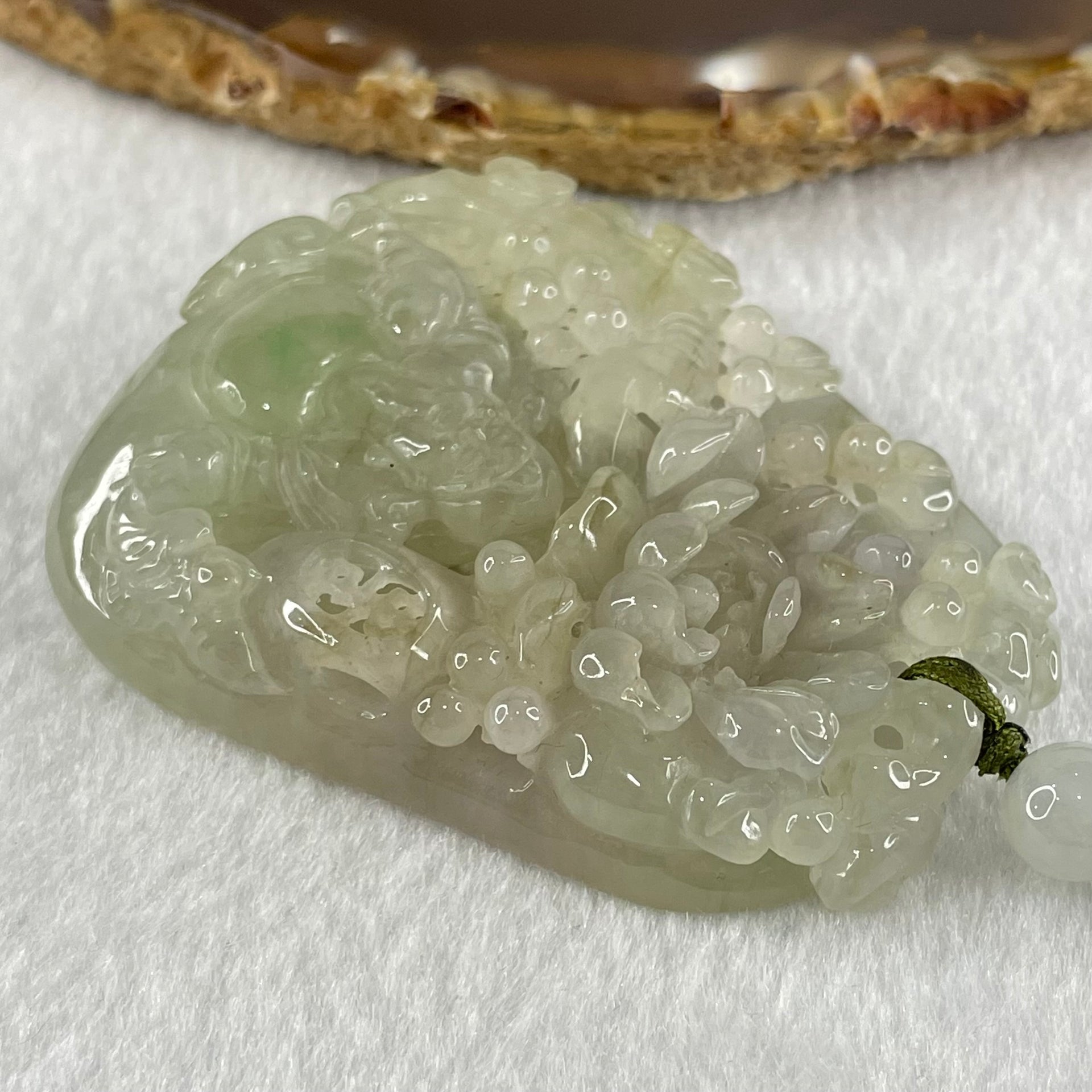 Grandmaster Type A Faint Lavender with Light Green Jadeite Cai Shen Ye with Prosperity Flowers and Bird 天宫赐福 Pendant 62.62g 56.88 by 46.94 by 13.07mm With NGI Cert 82838783 - Huangs Jadeite and Jewelry Pte Ltd