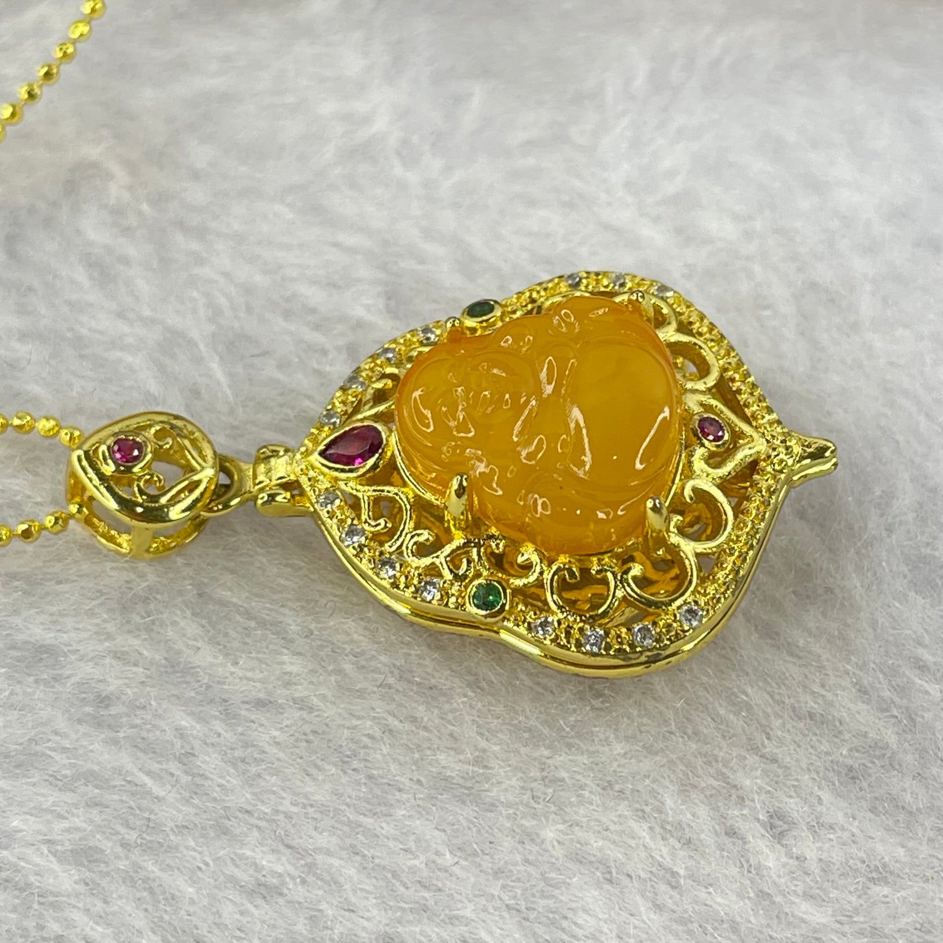 Natural Butterscotch Amber Milo Buddha with Crystals in Gold Color Necklace 5.64g 12.2 by 11.8 by 3.2mm - Huangs Jadeite and Jewelry Pte Ltd