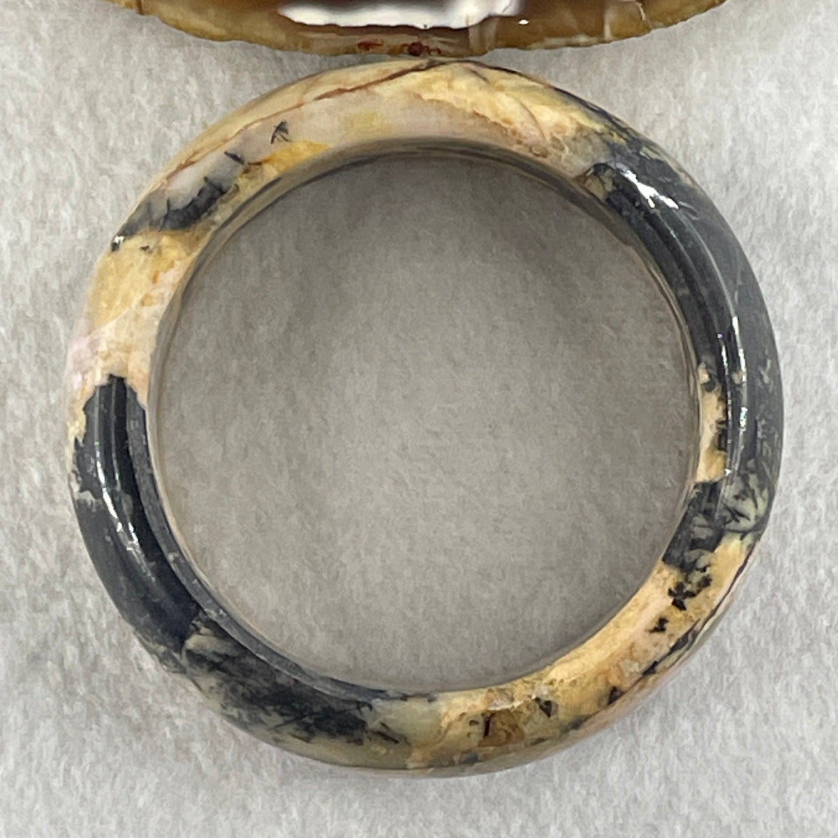 Entry Grade Natural Yellow with Black Rhodonite Bangle 105.93g Inner Diameter 55.2mm 25.5 by 11.7mm - Huangs Jadeite and Jewelry Pte Ltd