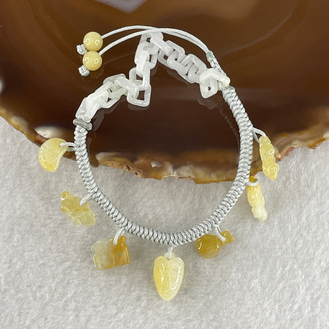 Natural Type A Yellowish Jadeite Money Bag Hulu Fu Butterfly in String Bracelet 8.79g 16-20cm 12.7 by 8.8 by 6.9mm