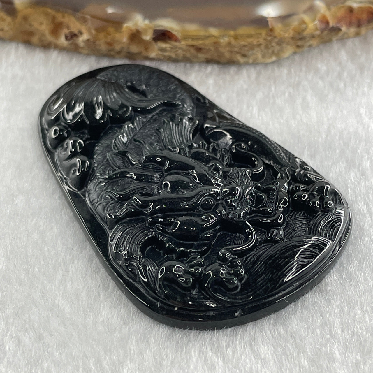 Type A Opaque to Partial Translucent Black Omphacite Jadeite Dragon Carp Pendant 20.39g 57.5 by 36.6 by 7.5mm - Huangs Jadeite and Jewelry Pte Ltd