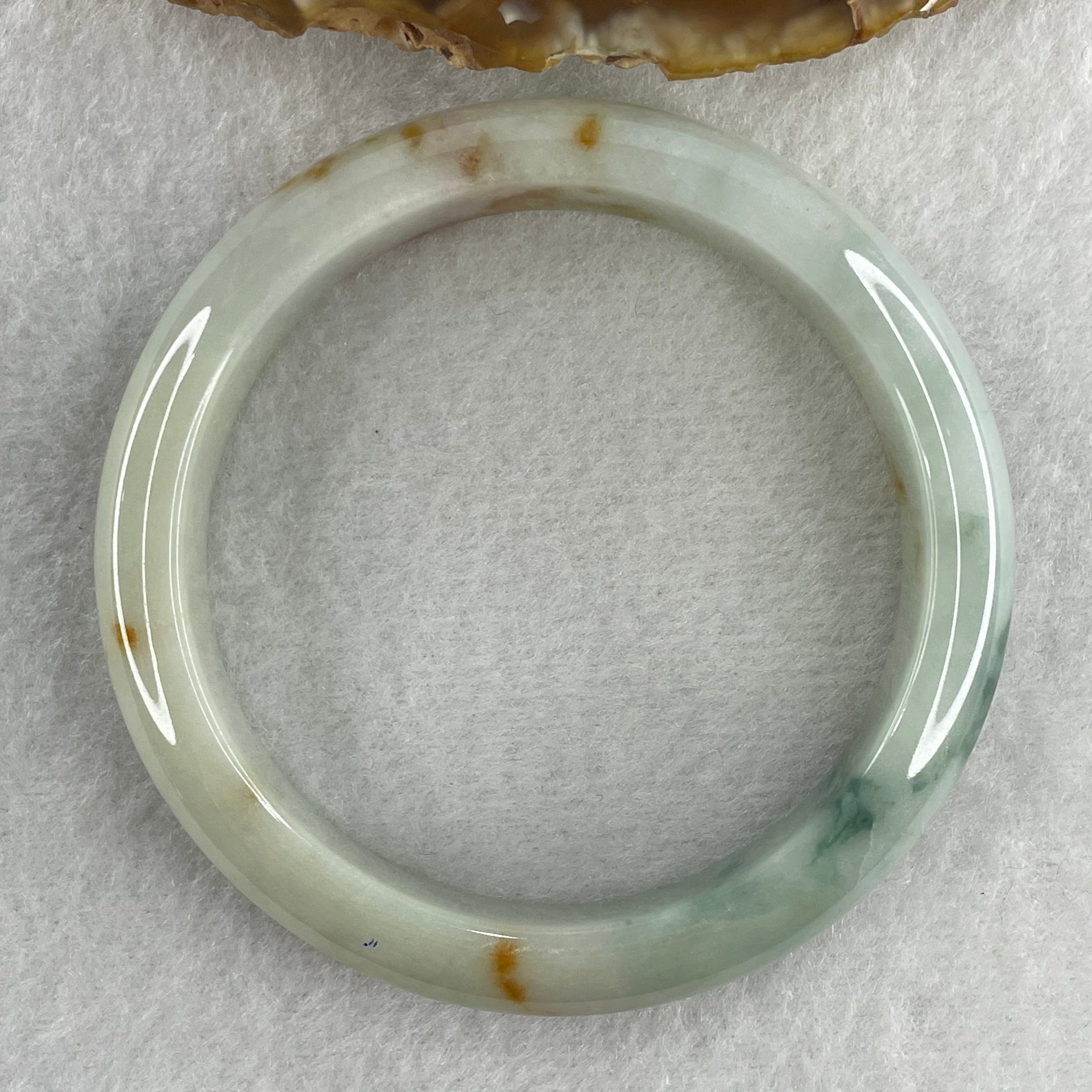 Type A Natural Light Green with Spicy Green and Brownish Patches Jadeite Bangle 55.09g Inner Diameter 57.5mm 12.7 by 9.0mm (Slight External Rough) - Huangs Jadeite and Jewelry Pte Ltd