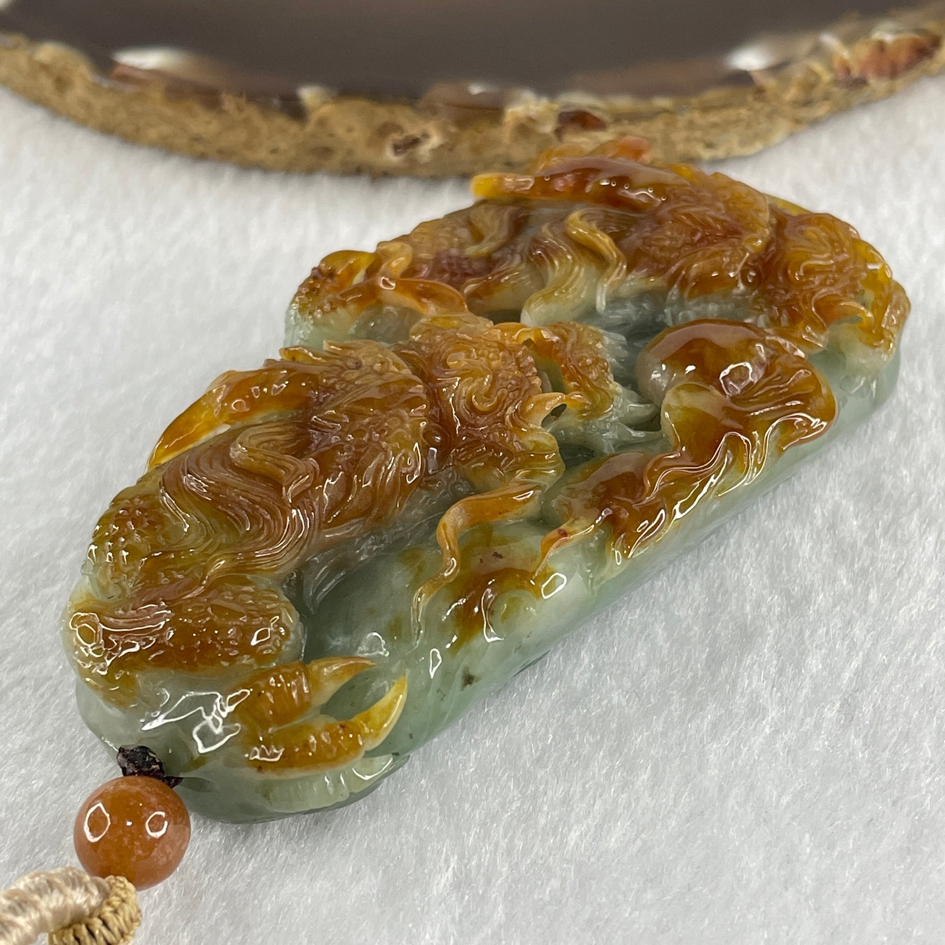 Grand Master Type A Green with Brownish Jadeite Dragon Double Side Pendant 125.78g 77.7 by 46.4 by 18.2mm - Huangs Jadeite and Jewelry Pte Ltd