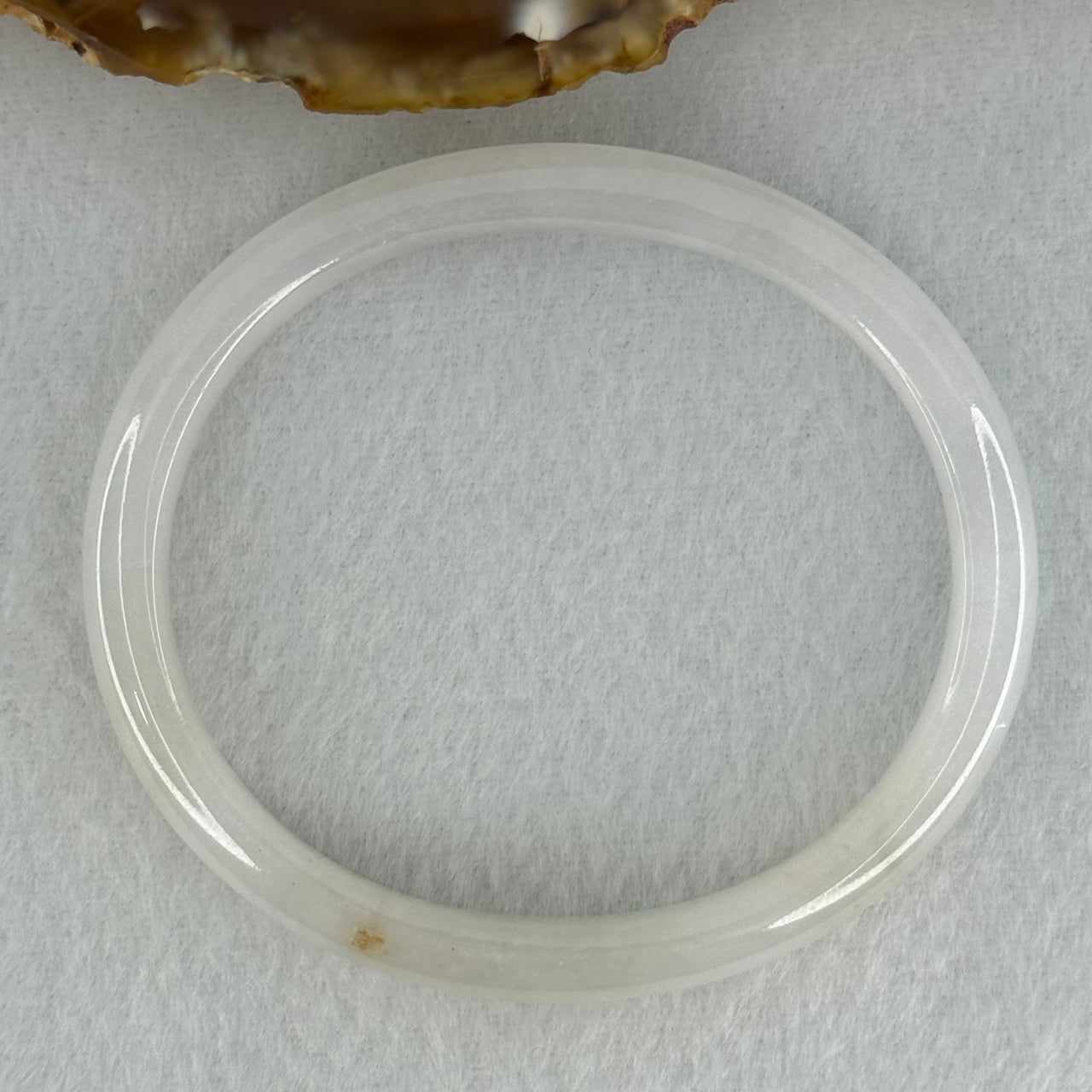 Type A Semi Icy Faint Lavender Green with Reddish Spot Jadeite Oval Bangle Internal Diameter 54.4mm 21.33g 7.5 by 6.0mm (very slight internal line) - Huangs Jadeite and Jewelry Pte Ltd