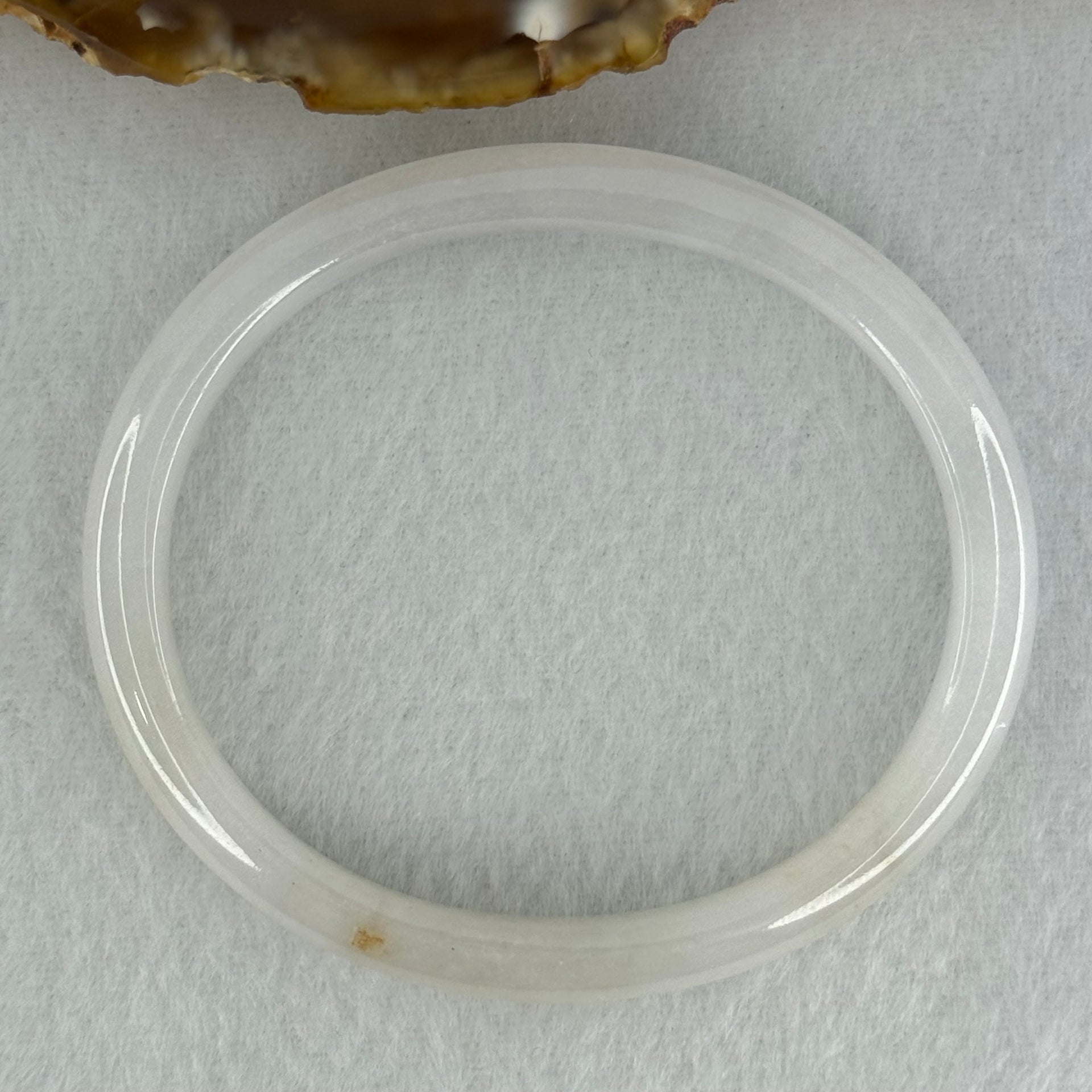 Type A Semi Icy Faint Lavender Green with Reddish Spot Jadeite Oval Bangle Internal Diameter 54.4mm 21.33g 7.5 by 6.0mm (very slight internal line) - Huangs Jadeite and Jewelry Pte Ltd