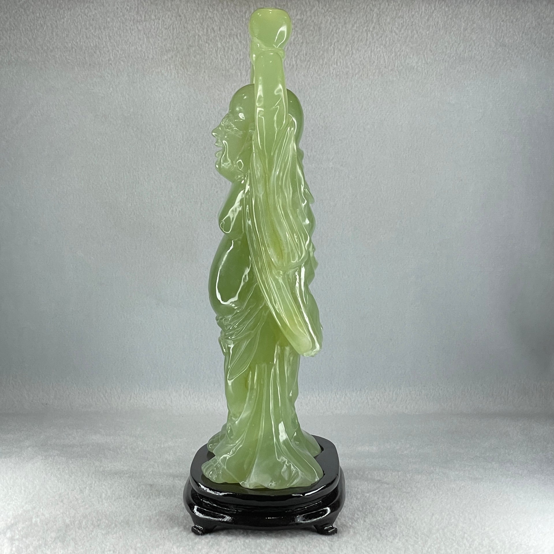 Natural Green Serpentine Stand Laughing Milo Buddha with Wealth Pot with Wooden Stand Display 1,599.3g 140.0 by 90.0 by 270.0mm - Huangs Jadeite and Jewelry Pte Ltd