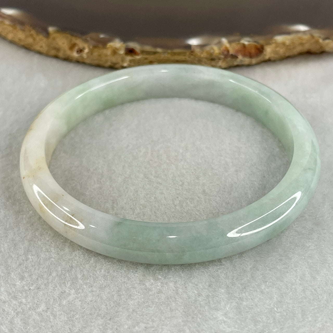 Type A Light Green with Brown Patches Jadeite Bangle 34.69g Inner Diameter 59.7mm 9.3 by 6.9mm (Very Slight Internal Lines) - Huangs Jadeite and Jewelry Pte Ltd