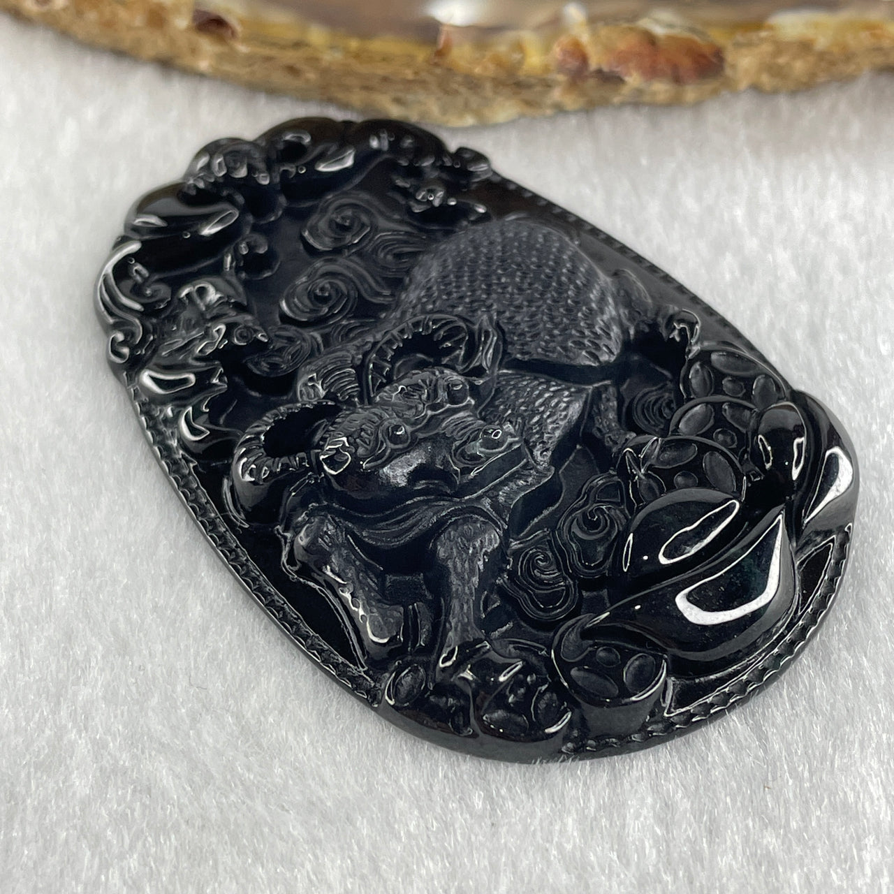 Type A Opaque to Partial Translucent Black Omphacite Jadeite Ox Pendant 20.24g 59.5 by 39.4 by 7.6mm - Huangs Jadeite and Jewelry Pte Ltd
