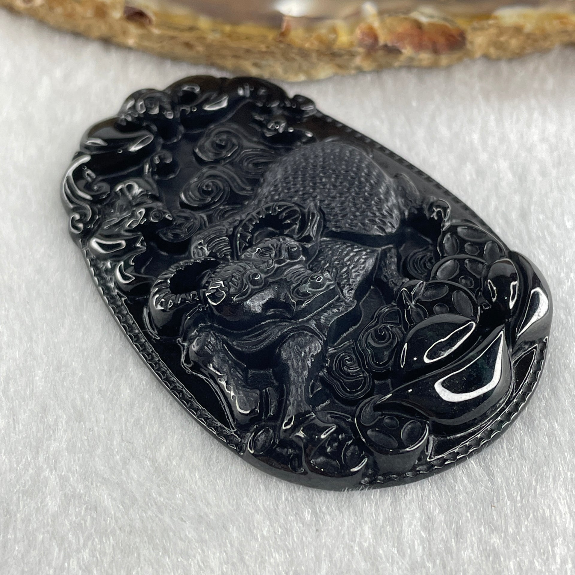 Type A Opaque to Partial Translucent Black Omphacite Jadeite Ox Pendant 20.24g 59.5 by 39.4 by 7.6mm - Huangs Jadeite and Jewelry Pte Ltd