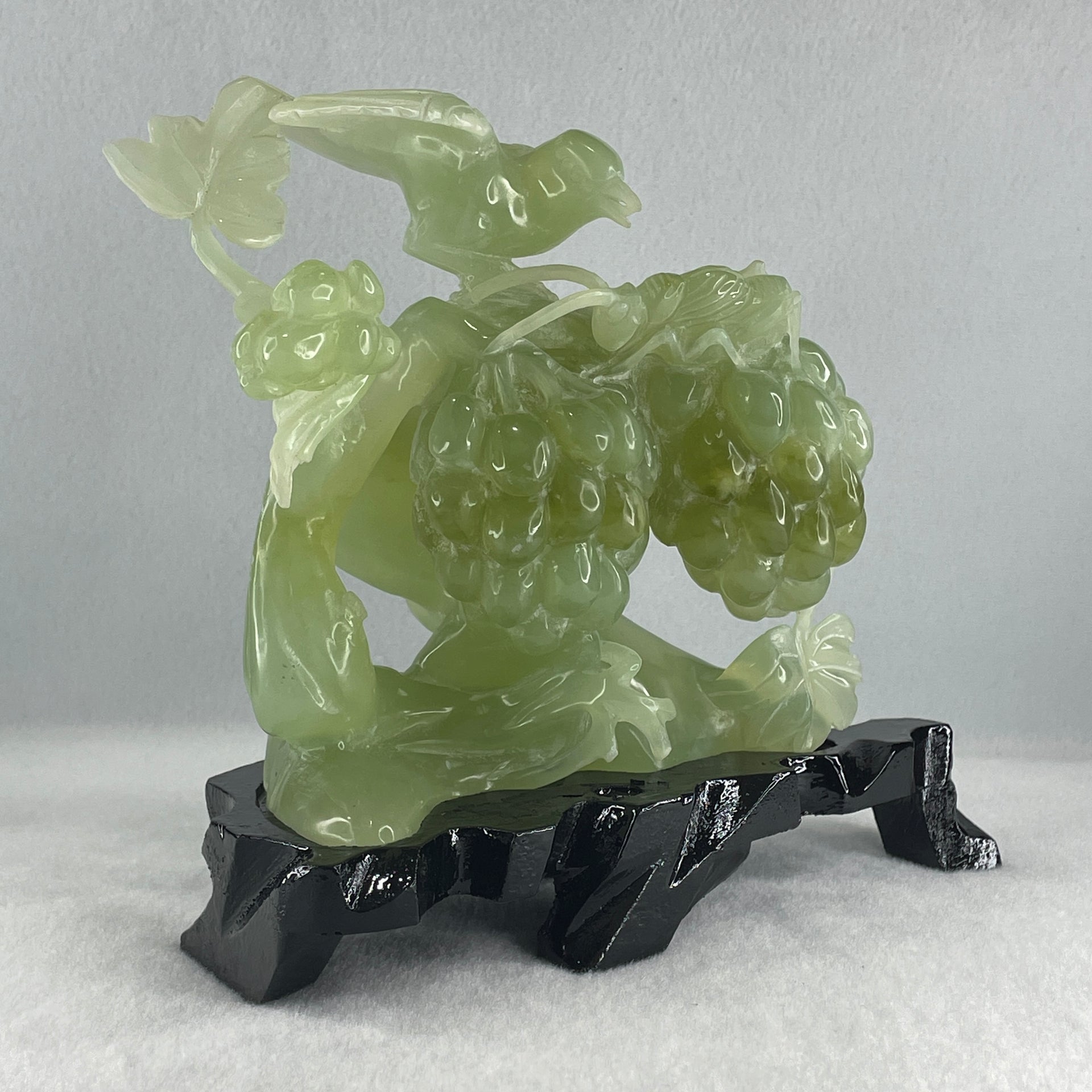 Natural Green Serpentine Magpie Bird with Cricket on Grape with Wooden Stand Display 1,042.7g L195.0 by B105.0 by H180.0 mm - Huangs Jadeite and Jewelry Pte Ltd
