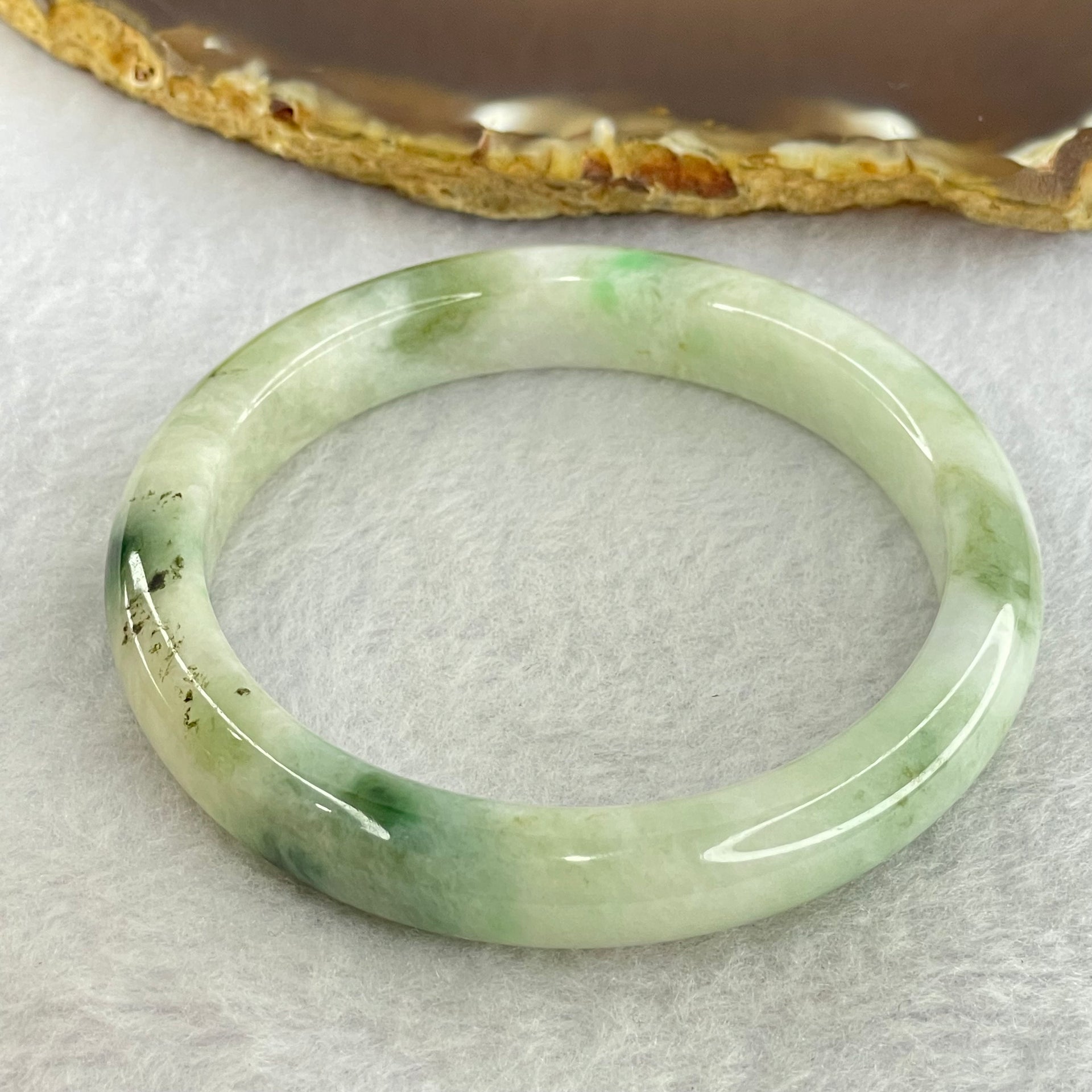 Type A Light Green with Moss Green Piao Hua Jadeite Bangle Internal Diameter 55.6mm 41.97g 10.4 by 7.6mm ( Very Slight External Rough + Internal Lines) - Huangs Jadeite and Jewelry Pte Ltd