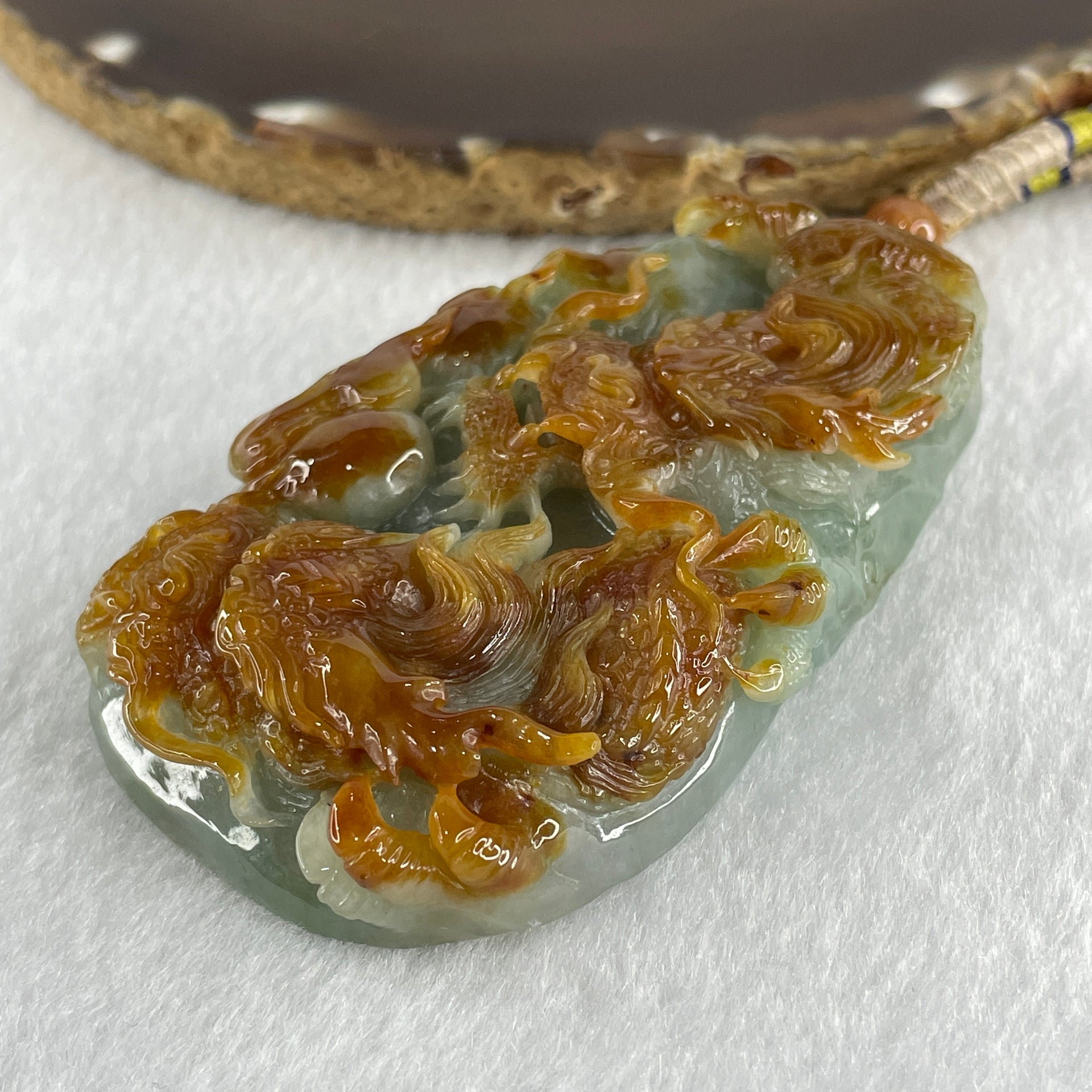 Grand Master Type A Green with Brownish Jadeite Dragon Double Side Pendant 125.78g 77.7 by 46.4 by 18.2mm - Huangs Jadeite and Jewelry Pte Ltd