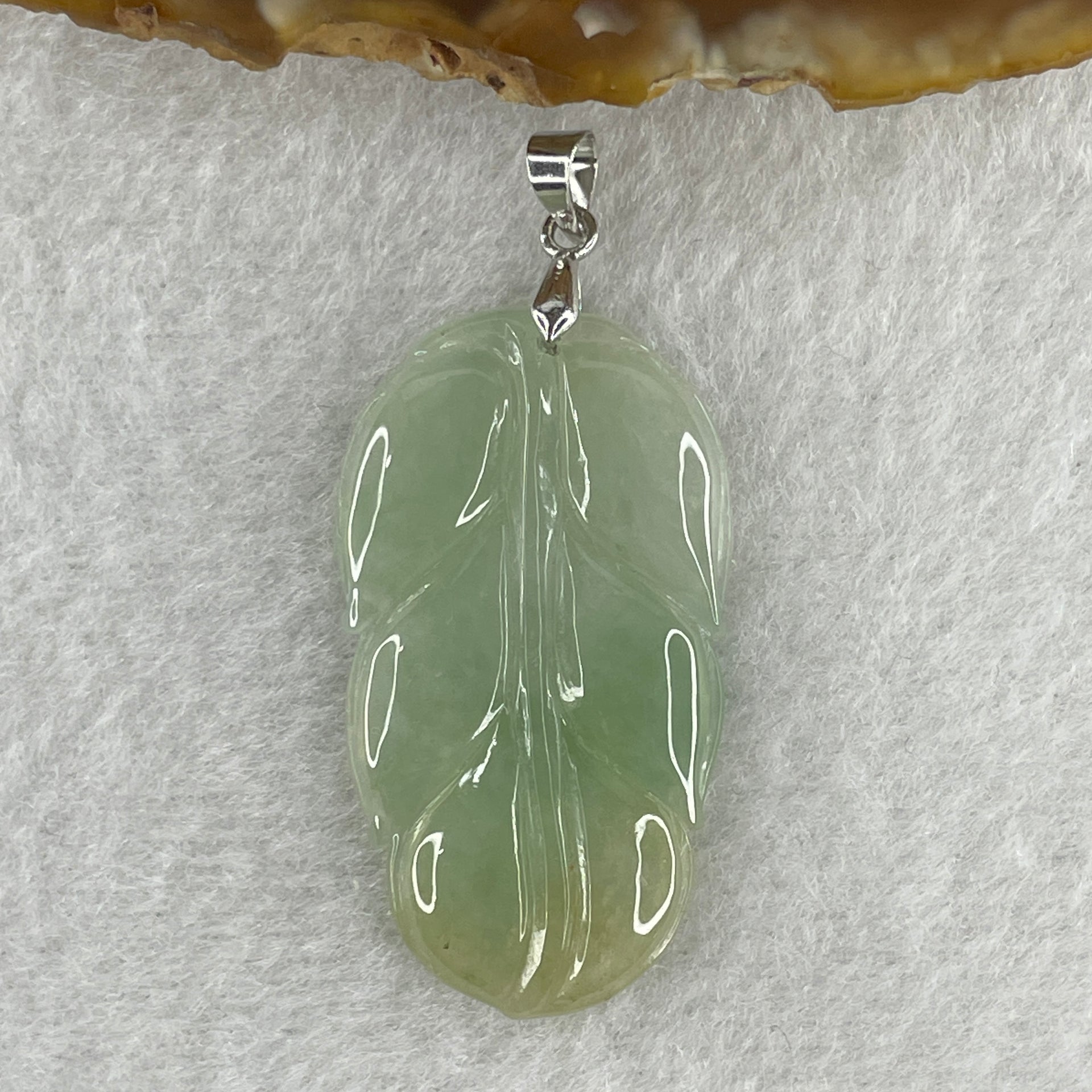 Natural Type A Semi Icy Light Green with Light Yellow Jadeite Prosperity Leaf Pendant in Silver Clasp Signifying Overnight Success 6.55g 38.4 by 21.6 by 4.0mm - Huangs Jadeite and Jewelry Pte Ltd