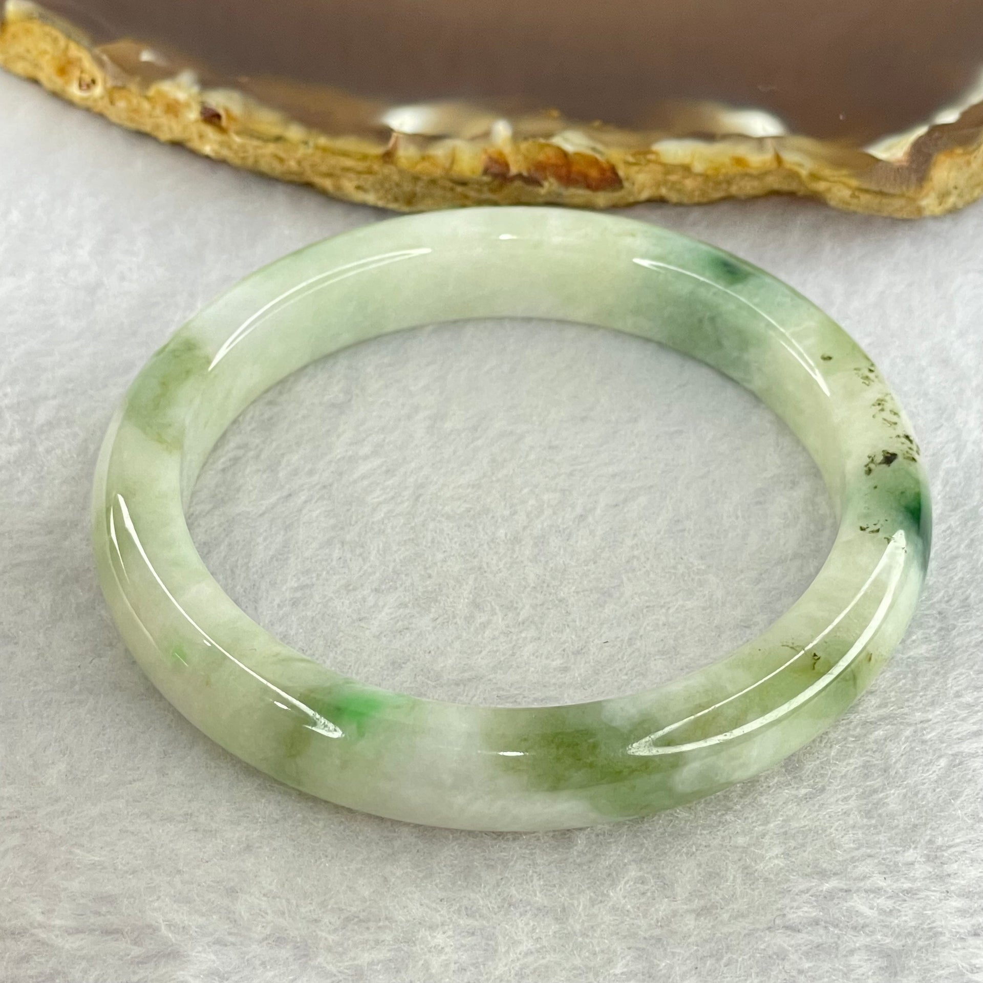 Type A Light Green with Moss Green Piao Hua Jadeite Bangle Internal Diameter 55.6mm 41.97g 10.4 by 7.6mm ( Very Slight External Rough + Internal Lines) - Huangs Jadeite and Jewelry Pte Ltd
