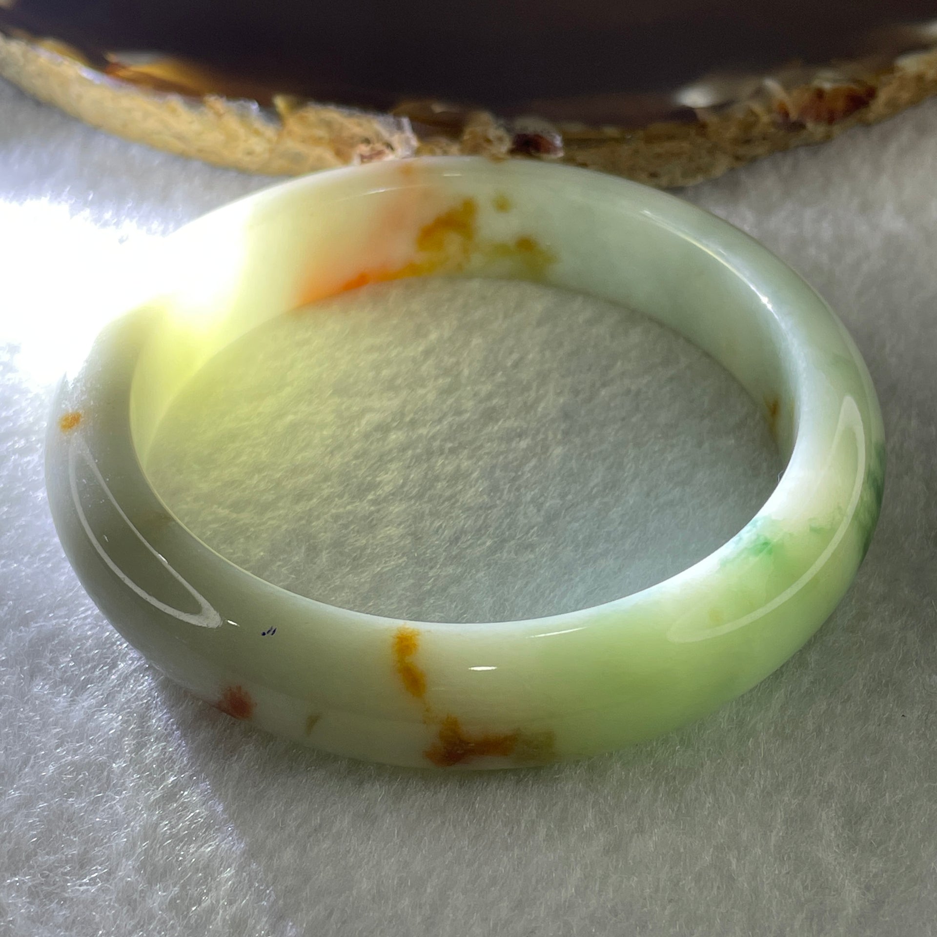 Type A Natural Light Green with Spicy Green and Brownish Patches Jadeite Bangle 55.09g Inner Diameter 57.5mm 12.7 by 9.0mm (Slight External Rough) - Huangs Jadeite and Jewelry Pte Ltd